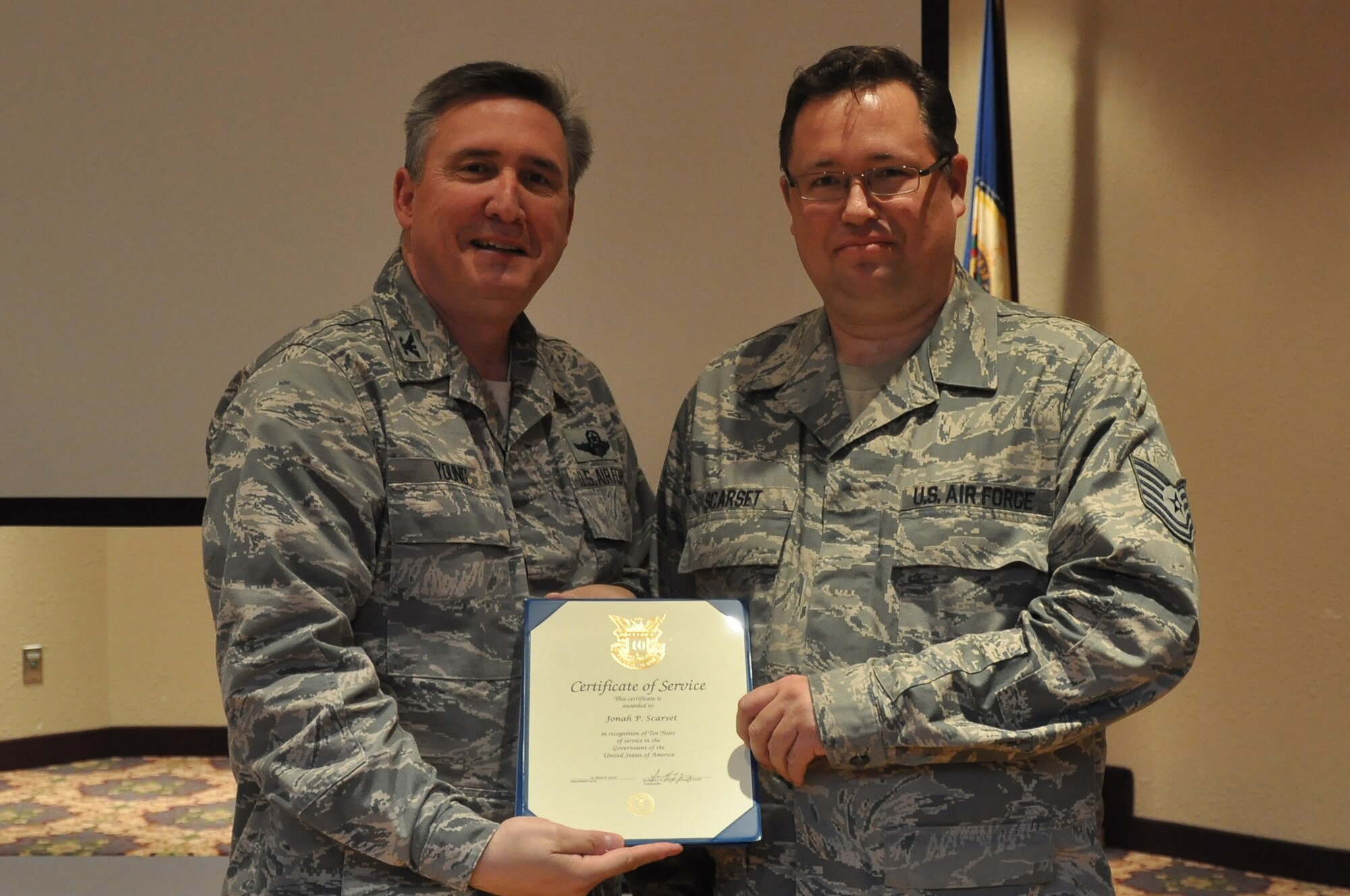 Colonol Darrell Young, 934th Airlift Wing Commander  presents 10 Service award to Jonah Scarset (Air Force Photo/TSgt Bob 