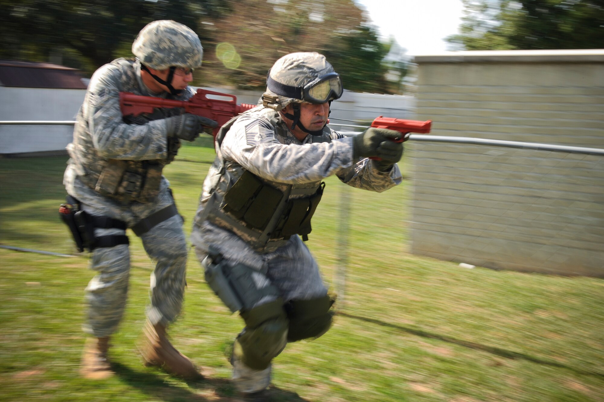 MOODY AIR FORCE BASE, Ga. -- Chief Master Sgt. Joseph Pritchard, 23rd Security Forces Squadron security forces manager, and Staff Sgt. Michael Grosso, 23rd SFS patrol leader, perform tactical team movements during active shooter training Oct. 28. Chief Pritchard believes it is important to give younger Airmen the necessary tools to keep the mission going because they are the future of the Air Force. (U.S. Air Force photo/Senior Airman Jamal D. Sutter)(RELEASED)
