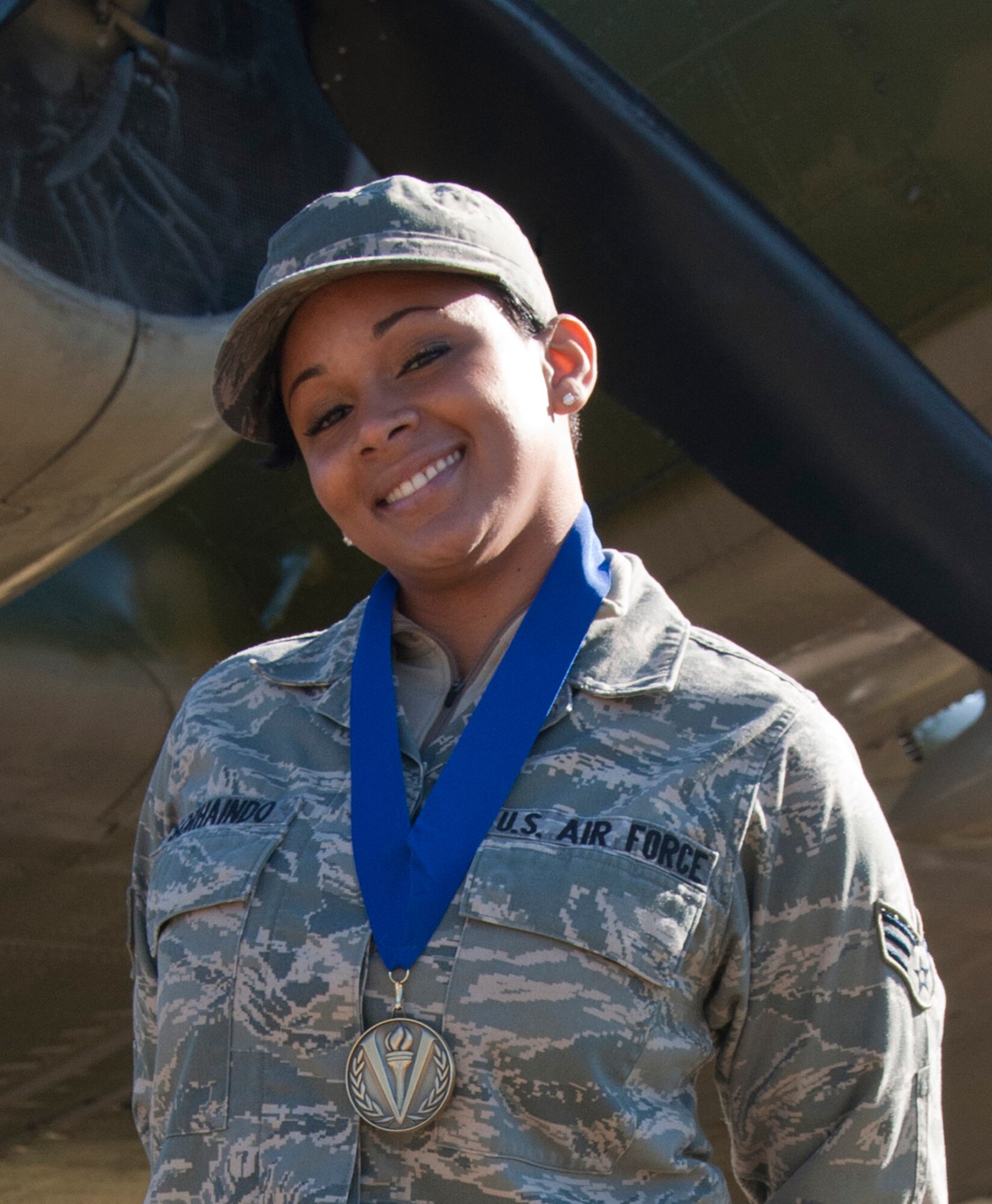 Senior Airman Allancia Sorhaindo, a military pay technician with the 315th Airlift Wing, displays her first place medal as the top referring servicemember of reserve accessions for fiscal year 2010 in the Get 1 Now Program. The Get 1 Now Program is sponsored by the Air Force Reserve and rewards reservists whose referrals turn into accessions. (U.S. Air Force photo/Senior Airman Robert Pilch) 
