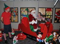 LAUGHLIN AIR FORCE BASE, Texas – A young Laughlin member meets Santa at Dinner with Santa at Club XL here Dec. 1. The dinner was preceded by a Christmas tree lighting and caroling by several Laughlin members. (U.S. Air Force photo by Airman 1st Class Blake Mize)