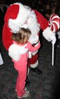 LAUGHLIN AIR FORCE BASE, Texas – A young Laughlin member meets Santa at Dinner with Santa at Club XL here Dec. 1. The dinner was preceded by a Christmas tree lighting and caroling by several Laughlin members. (U.S. Air Force photo by Airman 1st Class Blake Mize)