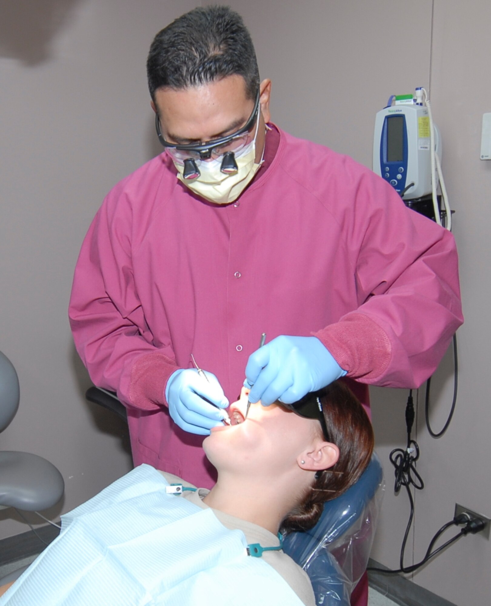 LAUGHLIN AIR FORCE BASE, Texas – Capt. Edward Gonzalez, 47th Medical Operations Squadron, conducts a check-up on Airman Ashley Kimbrell, 47th MDOS, Dec. 1. The dental clinic, along with the entire 47th Medical Group will undergo a major inspection later this month. (U.S. Air Force photo by Memo Lopez)