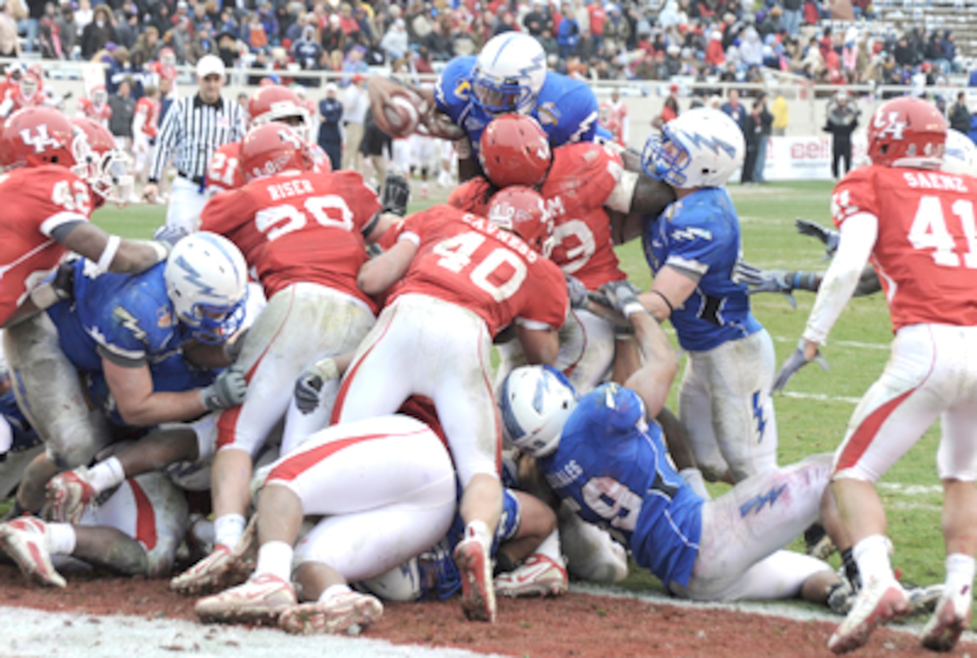 Falcons sophomore quarterback Tim Jefferson goes airborne for a touchdown on fourth and goal from the 1 during the Bell Helicopter Armed Forces Bowl Dec. 31, 2009, in Fort Worth, Texas. Jefferson had 161 passing yards and 37 rushing yards in Air Force's 47-20 victory. (U.S. Air Force photo/Bill Evans)