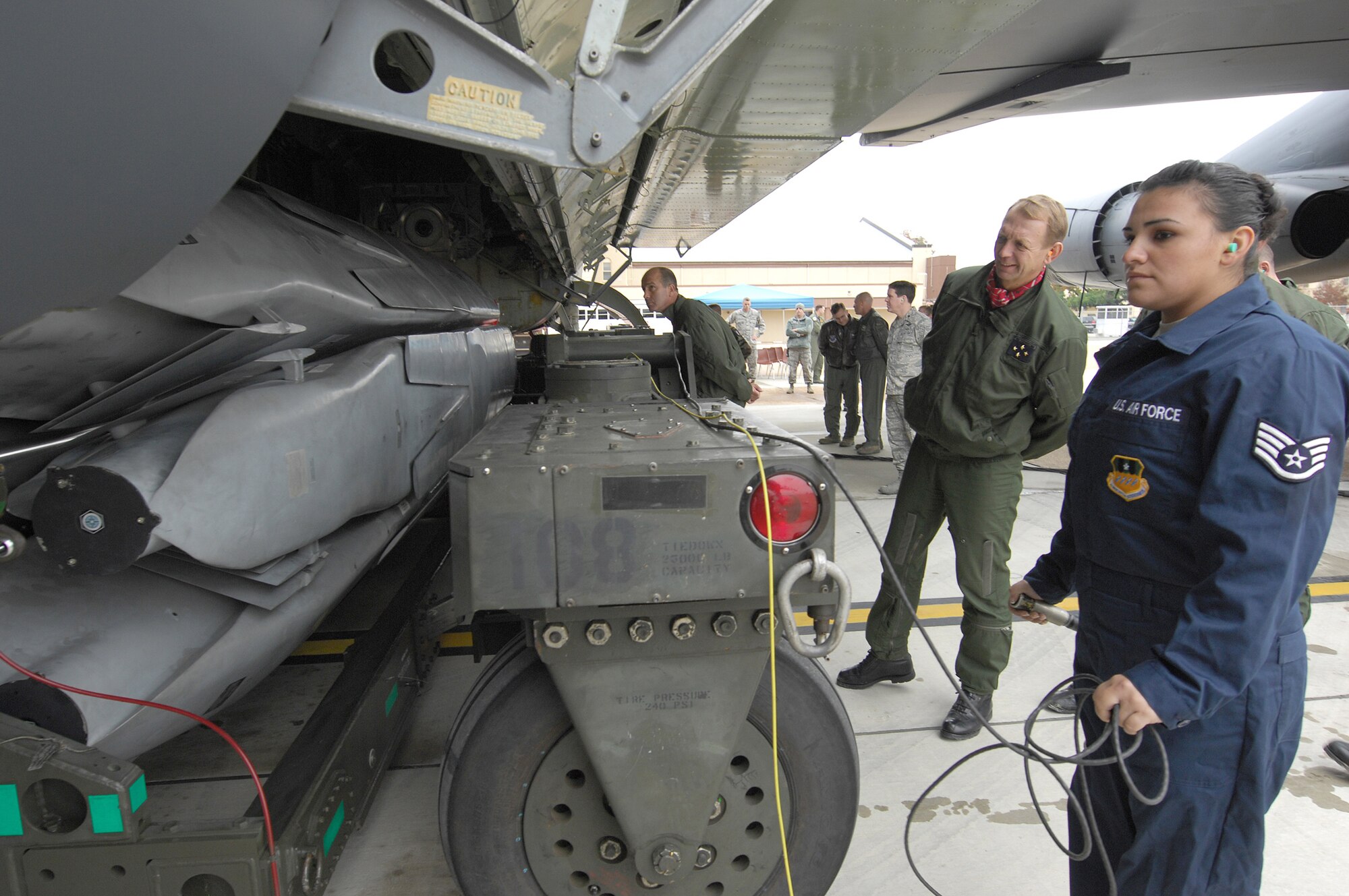French Lt. Gen. Paul Fouilland and a delegation of French military officers watch Staff Sgt. Tahnee Bouvy demonstrate how her team operates a weapons loader for a B-52 Stratofortress Nov. 15, 2010, during their visit to Air Force Global Strike Command. General Fouilland is the French Strategic Air Forces commander-in-chief and Sergeant Bouvy is a weapons load team member from the 2nd Bomb Wing at Barksdale Air Force Base, La. (U.S. Air Force photo/Master Sgt. Corey A. Clements)