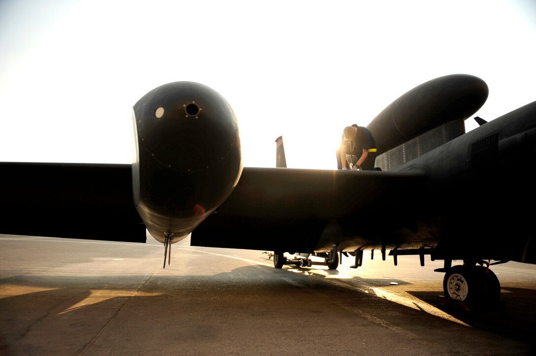Maintenance technicians assigned to the 380th Expeditionary Aircraft Maintenance Squadron, work in and around the U-2 Dragon Lady Nov. 23, 2010, at an air base in Southwest Asia. The Airmen are assigned to the 380th Expeditionary Aircraft Maintenance Squadron. (U.S. Air Force photo/Staff Sgt. Andy M. Kin)