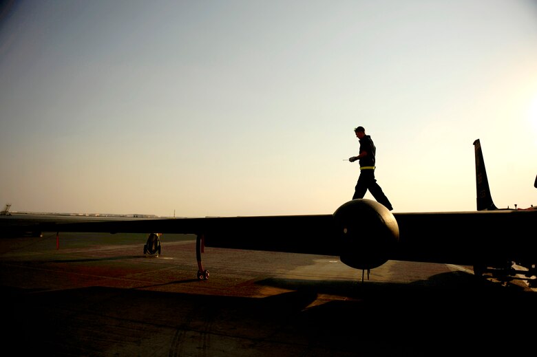 Senior Airman First Class Brian Burke walks down the wing of a U-2 Dragon Lady after all checks are complete Nov. 23, 2010, at an air base in Southwest Asia. Airman Burke is assigned to the 380th Expeditionary Aircraft Maintenance Squadron. (U.S. Air Force photo/Staff Sgt. Andy M. Kin)