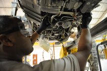 SEYMOUR JOHNSON AIR FORCE BASE, N.C. -- Airman 1st Class Eli Thompson replaces a fuel tube on an F-15E engine here, Nov. 30, 2010. In a recent deployment to Afghanistan, the propulsion flight provided six spare engines in three days, which is nine days less than typical production. Airman Thompson is a 4th Component Maintenance Squadron jet engine mechanic and hails from Detroit. (U.S. Air Force photo/Staff Sgt. Courtney Richardson)