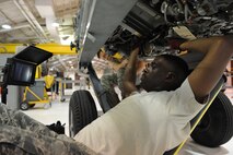 SEYMOUR JOHNSON AIR FORCE BASE, N.C. -- Staff Sgt. Michael Walton uses a microscopic camera to check for any foreign object debris damage on an F-15E engine fan here, Nov. 30, 2010. The damage is caused by intake suction from the jet engine, which is powerful enough to suck up loose material lying on the runway. Sergeant Walton is a 4th Component Maintenance Squadron jet engine mechanic and hails from Augusta, Ga. (U.S. Air Force photo/Staff Sgt. Courtney Richardson)