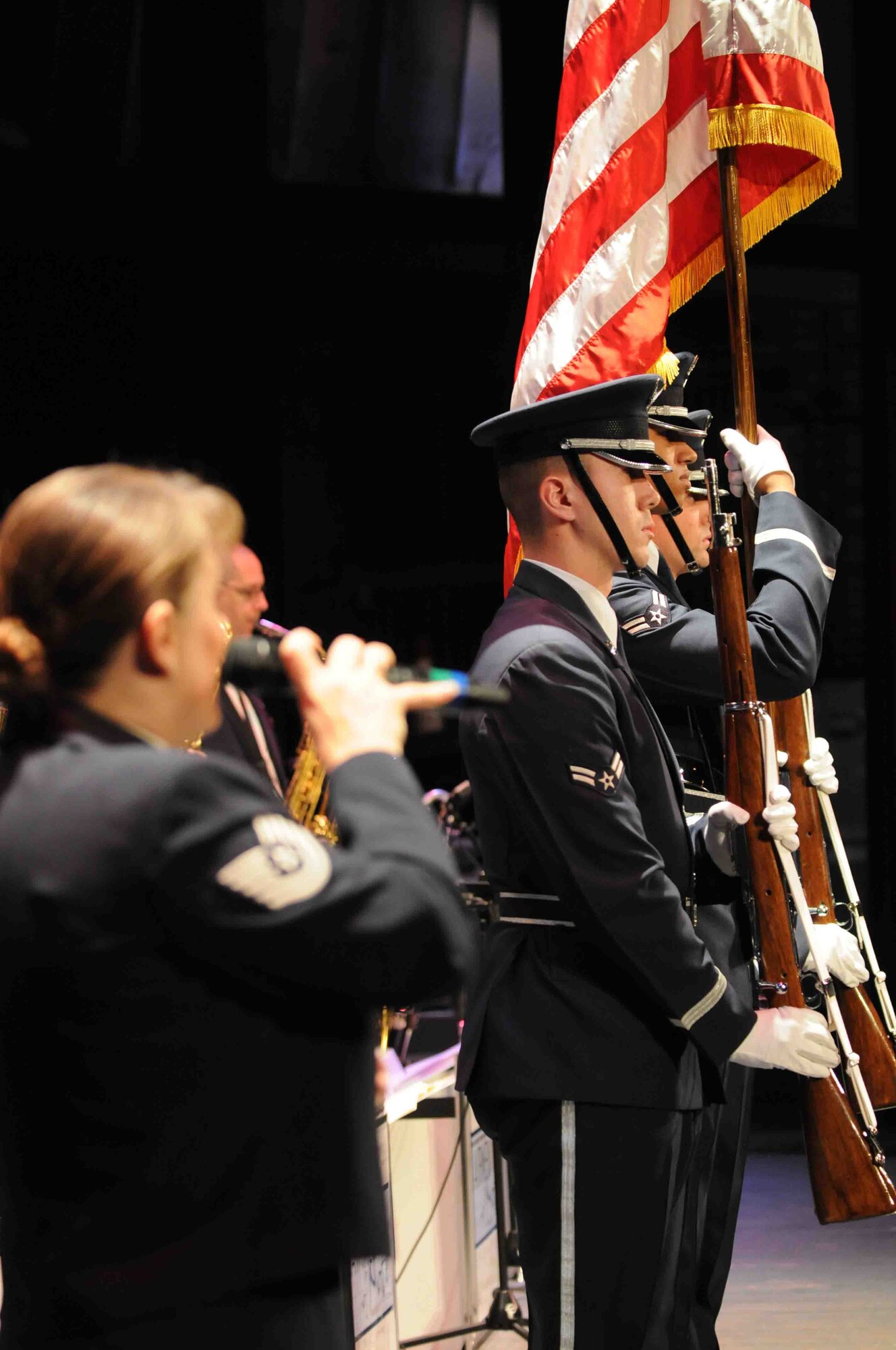 Members of the U.S. Air Force Honor Guard’s Colors Team present the colors Nov. 14 for an Airmen of Note show at the Capitol Theatre in Rome, N.Y. The Colors Team travels on the Note’s 2010 Fall Tour to present the Colors at the beginning and end of each of the 13 performances. (U.S.  Air Force photo by Air Force Airman 1st Class Tabitha N. Haynes)