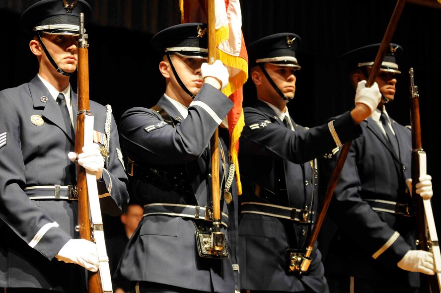 Members of the U.S. Air Force Honor Guard’s Colors Team present the colors on Veteran’s Day, Nov. 11, for an Airmen of Note show at West Springfield High School in West Springfield, Mass. The Colors Team travels on the Note’s 2010 Fall Tour to present the Colors at the beginning and end of each of the 13 performances. (U.S.  Air Force photo by Air Force Airman 1st Class Tabitha N. Haynes)