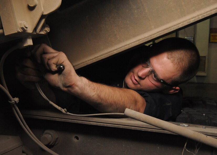 Staff Sgt. Dennis Behm, 22nd Logistics Readiness Squadron vehicleand equipment mechanic, opens the electrical box of a 60,000 pound aircraft cargo loader, Nov. 30, 2010, McConnell Air Force Base, Kan.  Sergeant Behm is identifying and repairing maintenance problems before McConnell accepts the $2.1 million loader.  The cargo loader will assist the 184th Intelligence Wing mission. (U.S. Air Force photo/Airman 1st Class Katrina M. Brisbin)