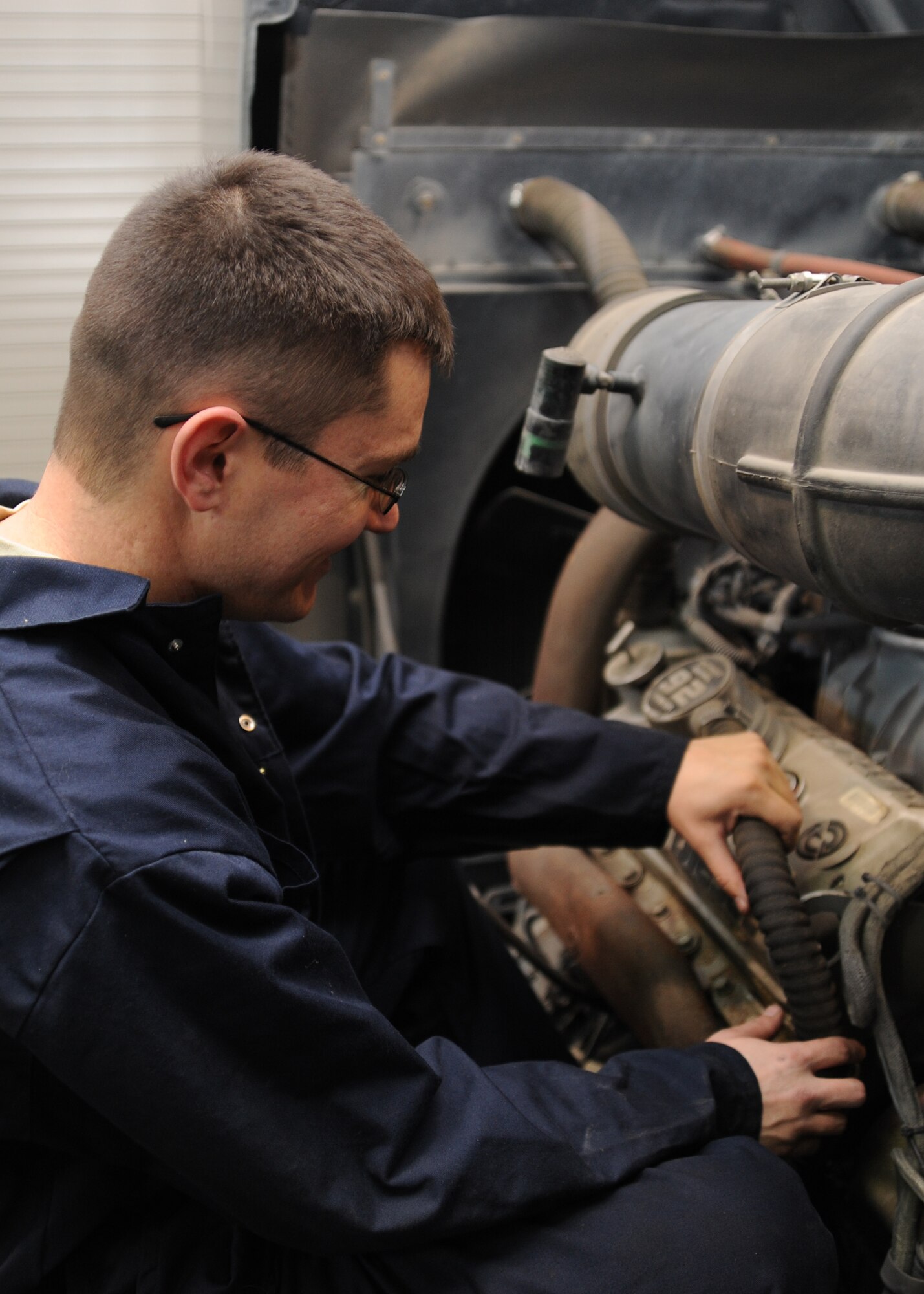 Staff Sgt. Jason York, 22nd Logistics Readiness Squadron vehicle and equipment mechanic, inspects an engine part on a snow maintenance vehicle, Nov. 30, 2010, McConnell Air Force Base, Kan. The vehicle requires maintenance inspections that are submitted to the Defense Reutilization and Marketing Office. Vehicle maintenance Airmen’s main duties include determining the overall mechanical condition of vehicles and equipment and correcting any deficiencies. (U.S. Air Force photo/Airman 1st Class Katrina M. Brisbin