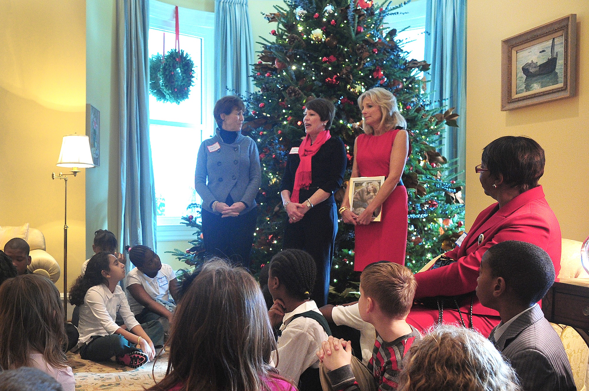 Cheryl McKinley (center) talks to children of National Guard families invited to take part in a holiday tree-trimming event Dec. 1, 2010, at the official residence of the vice president. During the event, children made cards for servicemembers and ornaments that will be on display at the residence throughout the holiday season. Standing with Mrs. McKinley are Dr. Jill Biden (right), the wife of Vice President Joe Biden; and Shelia Casey, the wife of Army chief of staff Gen. George W. Casey Jr. Mrs. McKinley is the wife of Air Force Gen. Craig R. McKinley, the chief of the National Guard Bureau. (U.S. Army photo/Sgt. 1st Class Jon Soucy)