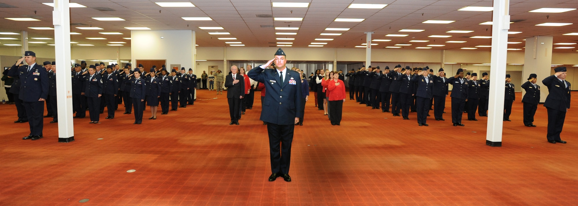 Col. Dave Zeh leads Air Reserve Personnel flights as the commander of the troops during the National Anthem at the change of command ceremony Nov. 29, 2010. Col. Patricia Blassie assumed command of the center from Brig. Gen. Kevin Pottinger. (U.S. Air Force photo/Kevin Bell)