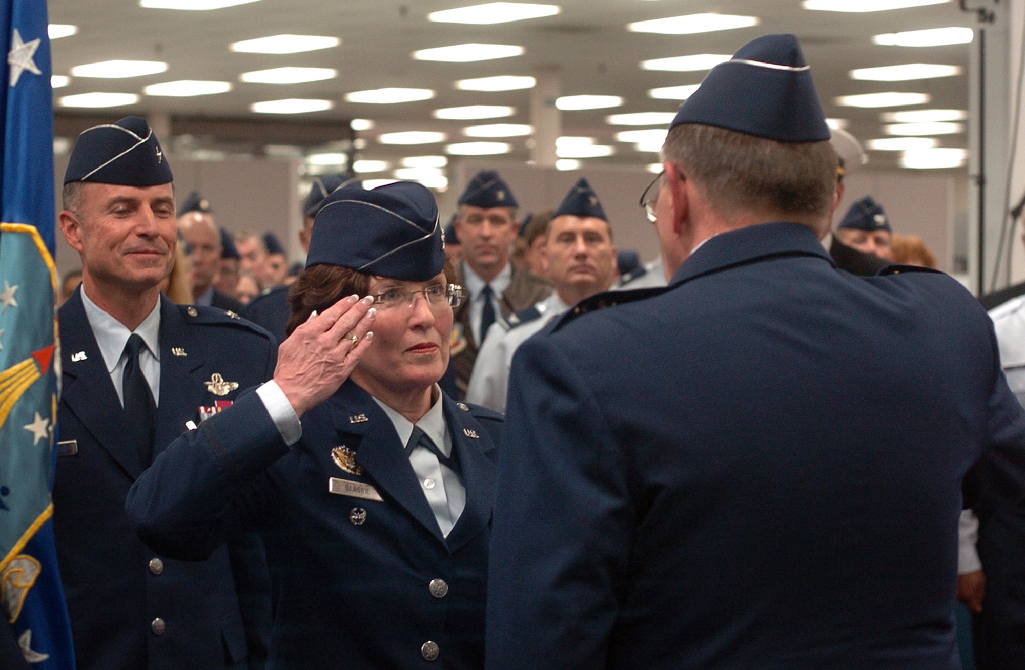Col. Patricia S. Blassie salutes Lt. Gen. Charles E. Stenner, Jr., commander, Air Force Reserve Command, after accepting command of the Air Reserve Personnel Center in Denver, Nov. 29, 2010. Brig. Gen. Kevin E. Pottinger, (left) relinquished command of the center to serve as the mobilization assistant to the Assistant Secretary of the Air Force for Manpower and Reserve Affairs at the Pentagon. Colonel Blassie was the executive officer to the Chief of the Air Force Reserve at Robins Air Force Base, Ga., before assuming command of ARPC. (U.S. Air Force photo/Greg Simmonds)