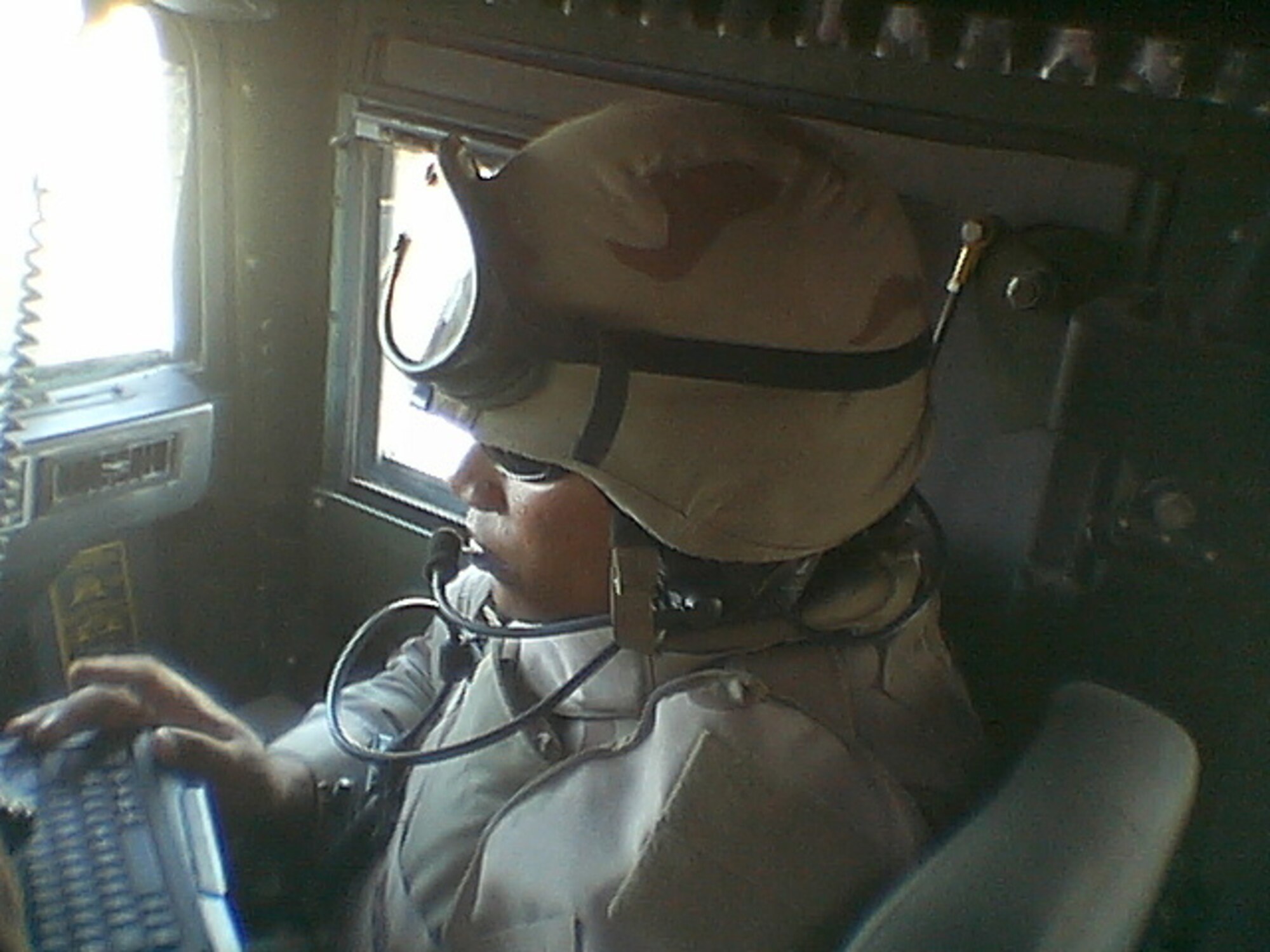 Tech. Sgt. Lorenzo Zapata sits at his convoy work station in a convoy humvee in Iraq, 2007. Sergeant Zapata recently finished his time as a DTC facilitator, and has returned to regular duty at the 1st Combat Communications Squadron at Ramstein Air Base. (Courtesy Photo)