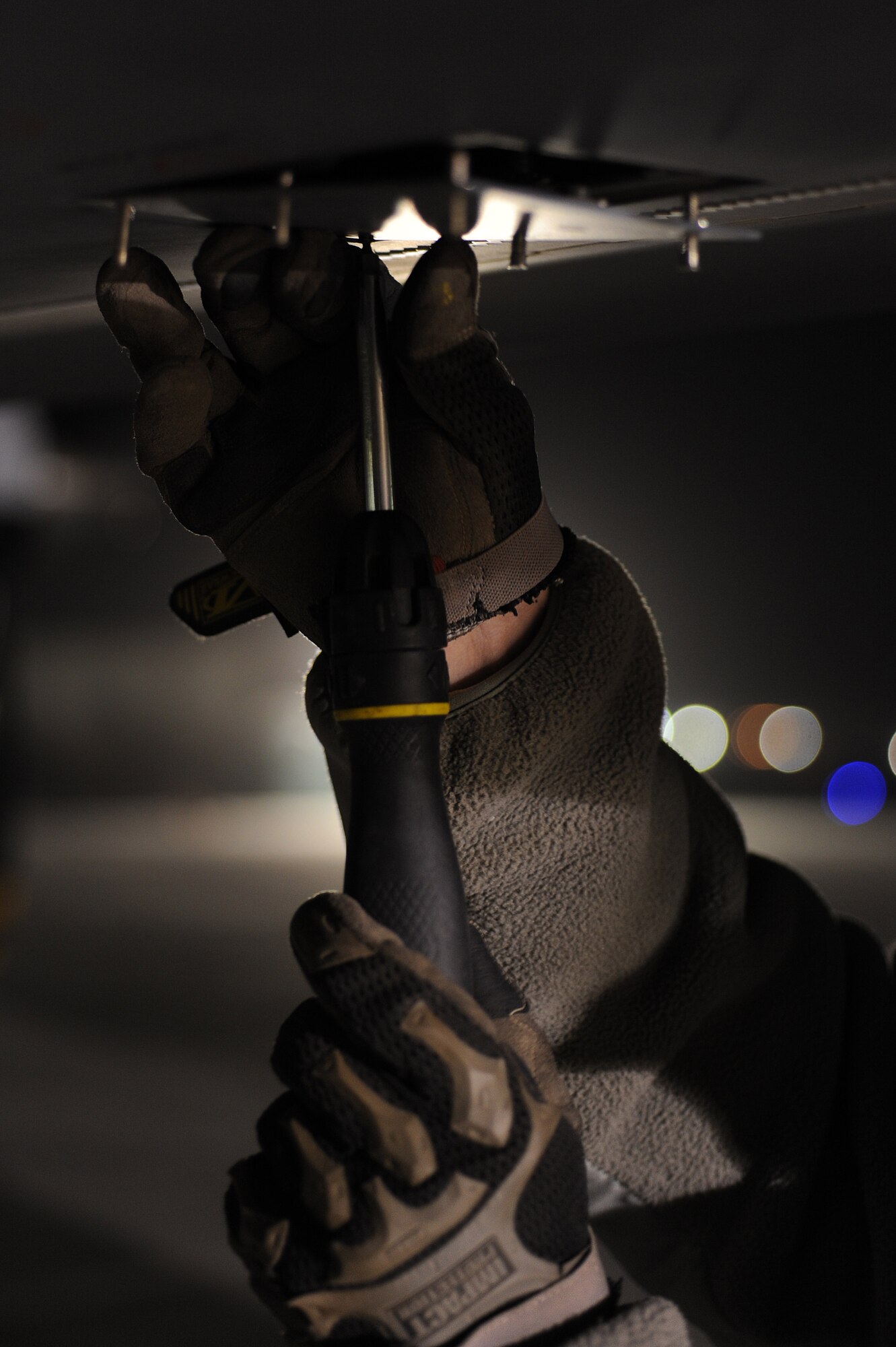 Staff Sgt. Matthew removes a wing access panel on an MQ-9 Reaper during a 100-hour inspection Dec. 1, 2010, at Kandahar Airfield, Afghanistan. Airmen accepted control of the MQ-9 maintenance operations this day making them the first military members to work on the aircraft for Operation Enduring Freedom in Afghanistan. Sergeant Matthew, from Creech Air Force Base, Nev., is a dedicated crew chief assigned to the 451st Expeditionary Aircraft Maintenance Squadron MQ-9 Aircraft Maintenance Unit. (U.S. Air Force photo by Tech. Sgt. Chad Chisholm/Released)