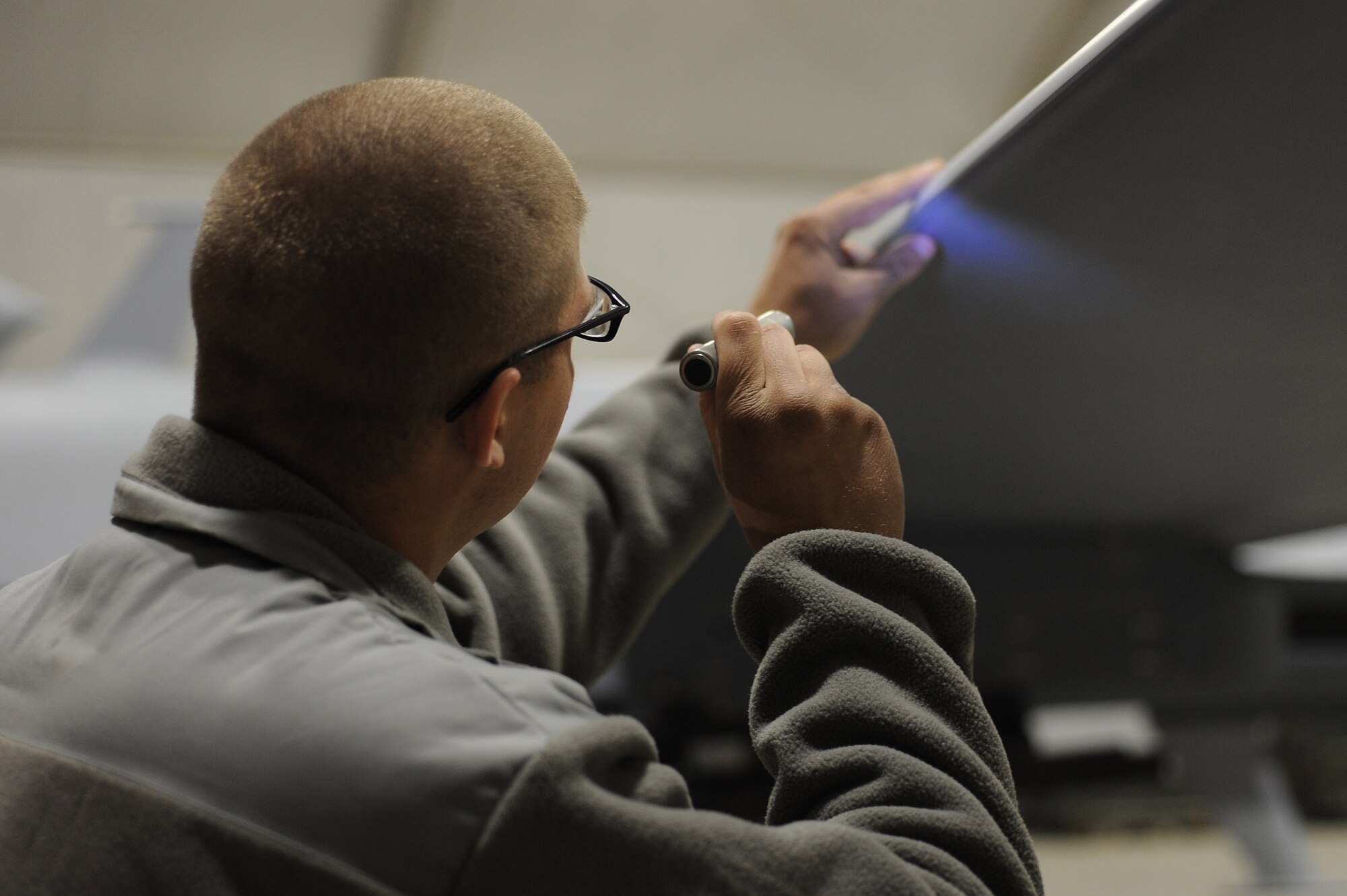Senior Airman Joshua inspects MQ-9 Reaper wings for cracks, scratches, or chips during a preflight inspection Dec. 1, 2010, at Kandahar Airfield, Afghanistan. Airmen accepted control of the MQ-9 maintenance operations this day making them the first military members to work on the aircraft for Operation Enduring Freedom in Afghanistan. Airman Joshua, from Creech Air Force Base, Nev., is a tactical aircraft maintenance journeyman assigned to the 451st Expeditionary Aircraft Maintenance Squadron MQ-9 Aircraft Maintenance Unit. (U.S. Air Force photo by Tech. Sgt. Chad Chisholm/Released)