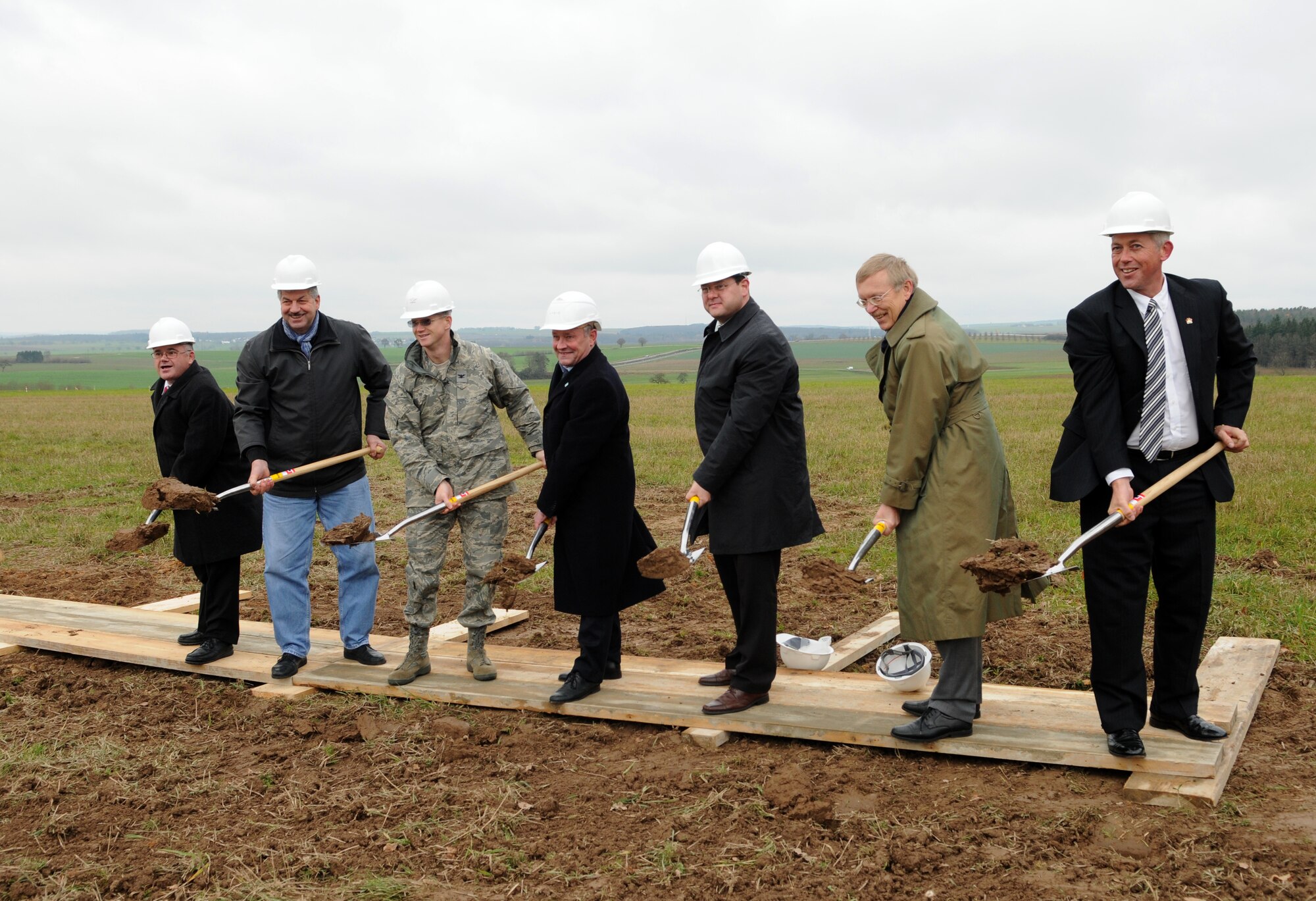 SPANGDAHLEM AIR BASE, Germany – Col. Christopher Weggeman, 52nd Fighter Wing commander, and distinguished guests from the local area break ground at the site of the new Base Exchange Nov. 23. The ground-breaking marked the construction of a $24 million project, which is scheduled for completion in the summer of 2012. (U.S. Air Force photo/Staff Sgt. Benjamin Wilson)