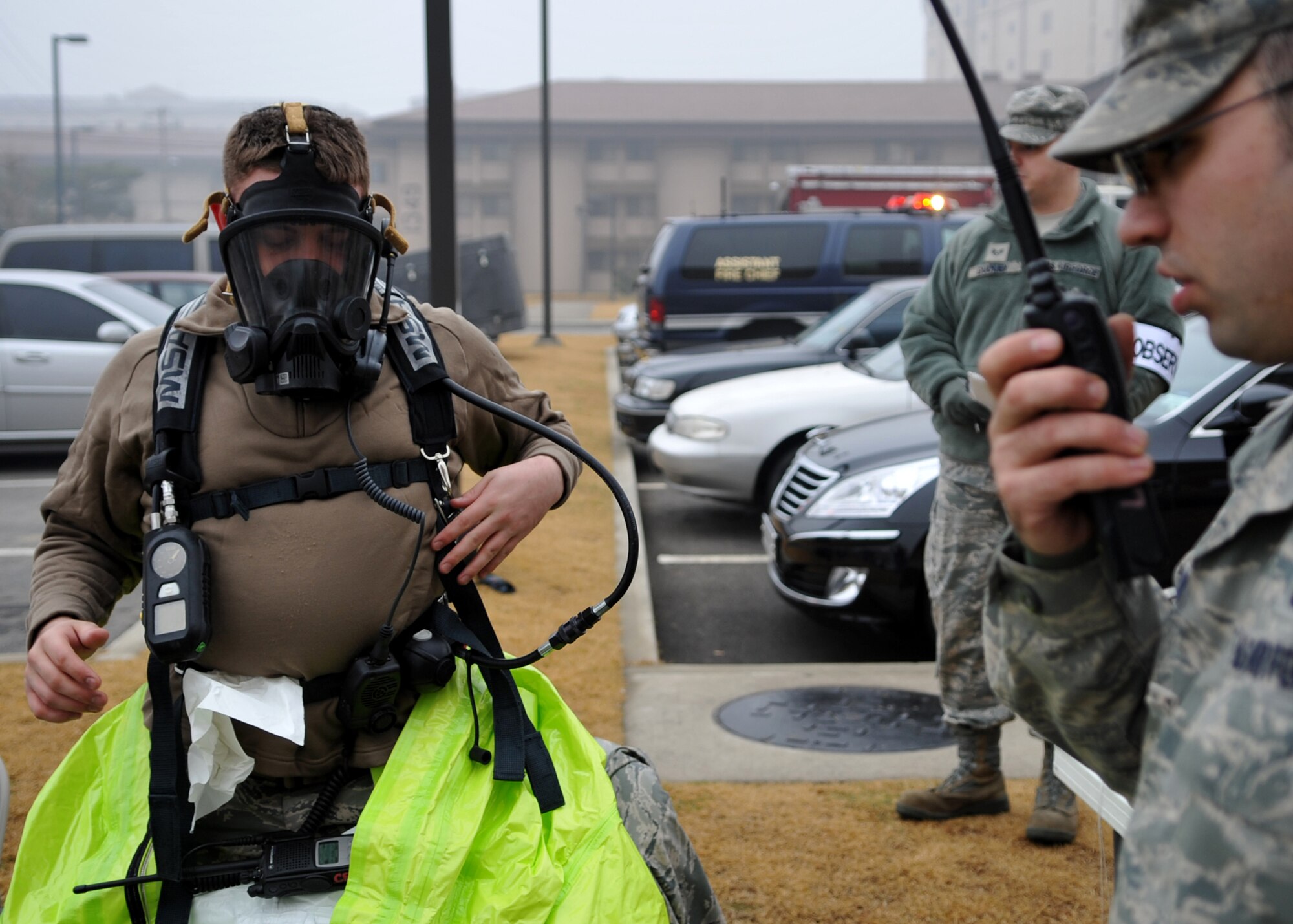 Senior Airman Jared Sims, 51st Civil Engineer Squadron, adjusts his gear during an Emergency Management Exercise Dec. 1. The exercise simulated a biological attack designed to evaluate emergency responders and search and recovery efforts. (U.S. Air Force Photo /Senior Airman Evelyn Chavez)