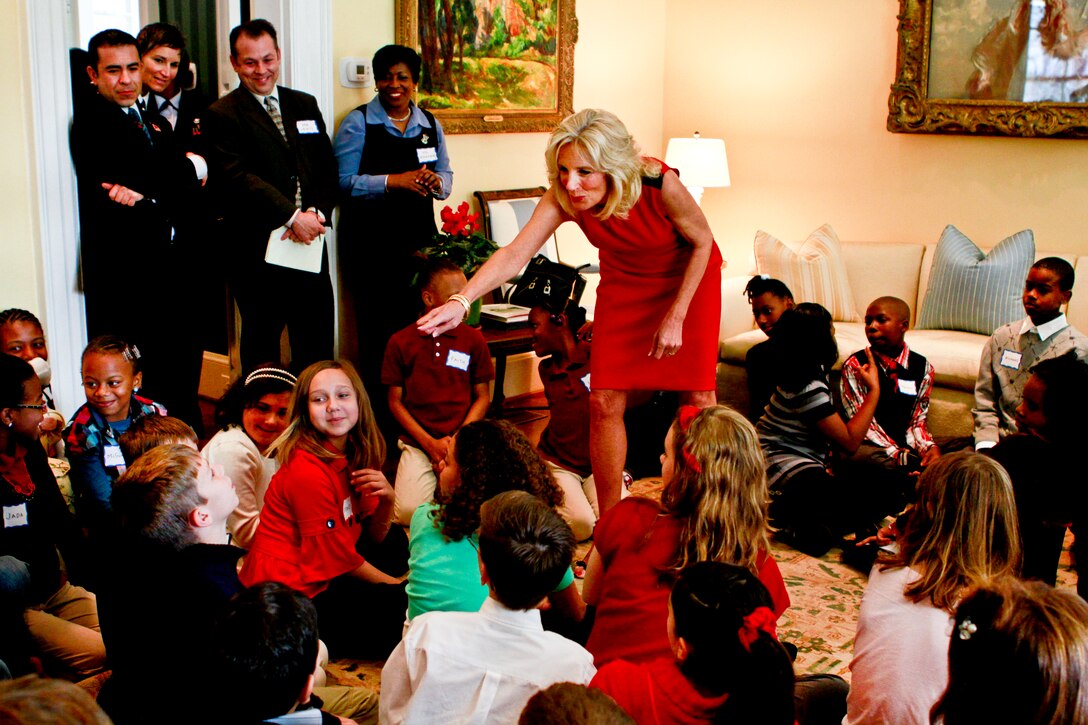 Dr. Jill Biden, wife of Vice President Joe Biden, helps children form three groups during a holiday party at her home at the Naval Observatory in Washington, D.C., Dec. 1, 2010. The children made cards and ornaments, and decorated cookies.