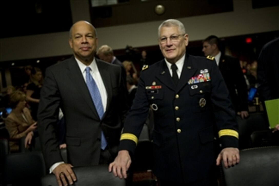 Department of Defense General Counsel Jeh C. Johnson (left) and Commander, U.S. Army Europe Gen. Carter Ham appear before the Senate Armed Services Committee on Dec. 2, 2010.  Johnson and Ham will testify with Secretary of Defense Robert M. Gates and Chairman of the Joint Chiefs of Staff Adm. Mike Mullen regarding the findings of the "Don't Ask, Don't Tell" Comprehensive Working Group report.  