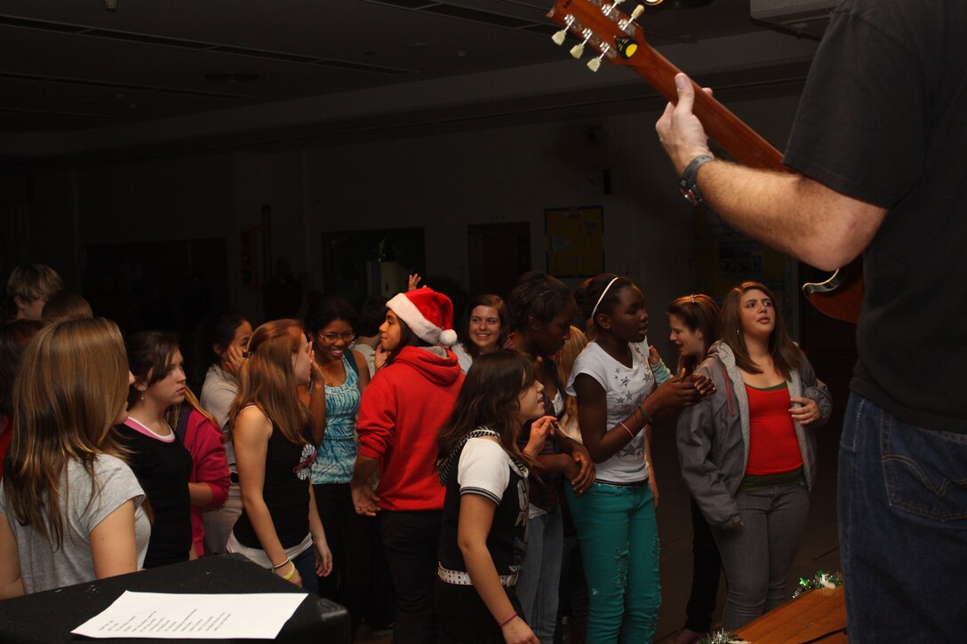 Students of Mathew C. Perry High School dance to Rock ‘N’ Roll Junkeez at the Jingle Bell Rock-A-Thon held in the M.C. Perry gym here Dec. 6. The dance was held to support the M.C. Perry High School cheerleaders and to help pay for new cheerleading uniforms.