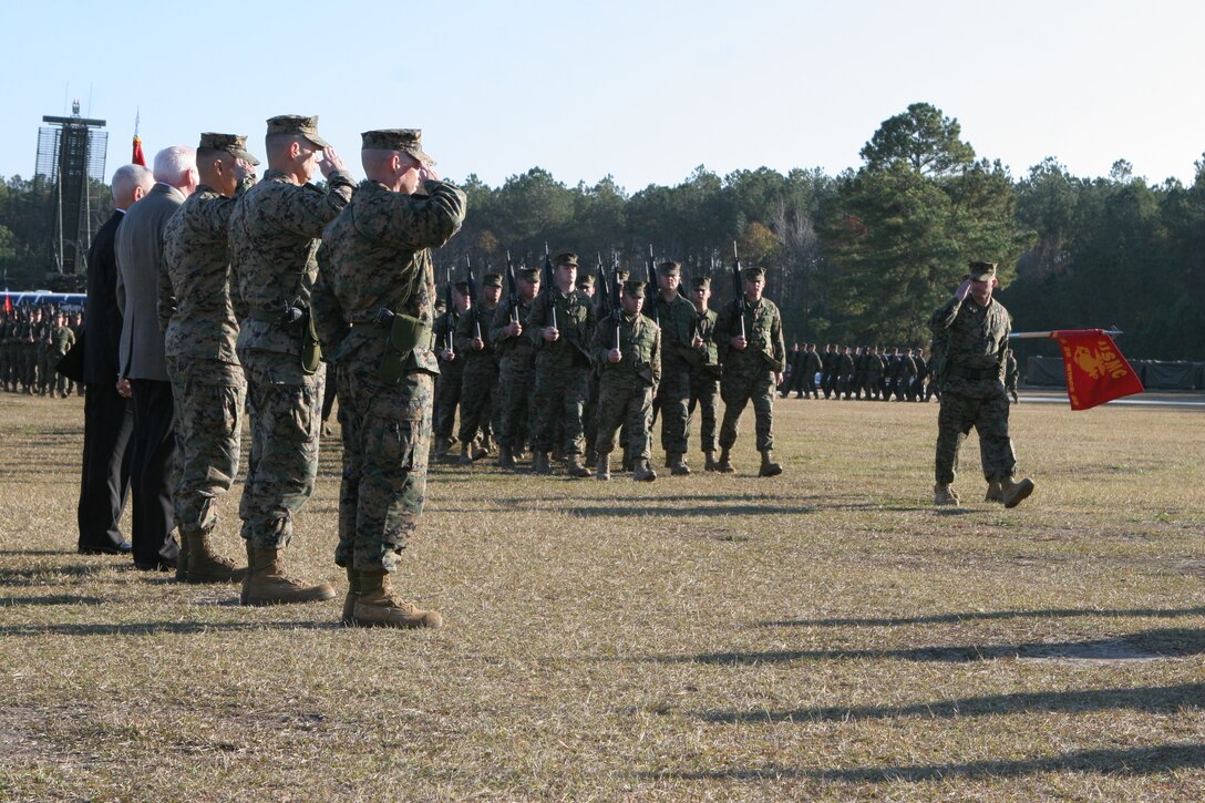 From left to right, Retired Cols. Vincent C. Giani and Larry Groves; and Cols. Kenyon M. Gill, Jeffrey L. Merchant and Peter J. DeVine stand at attention and salute during the pass and review at Marine Air Control Group 28’s change of command ceremony Dec. 3 at the Marine Air Control Squadron 2 parade field. Merchant relinquished command to DeVine after 27 months of duty as the commanding officer of MACG-28. DeVine joined the ranks of the other men as Marines who have commanded MACG-28.