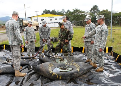 SOTO CANO AIR BASE, Honduras - Soldiers and Airmen from Joint Task Force-Bravo work on assembling a Forward Air Refueling Point at Fuerte General Hogar De Los in Siguatepeque, Honduras. FARP assembly training was part of a two-day exercise conducted by JTF-B that included water purification.  (photo by Tech. Sgt. Edward Roldan)