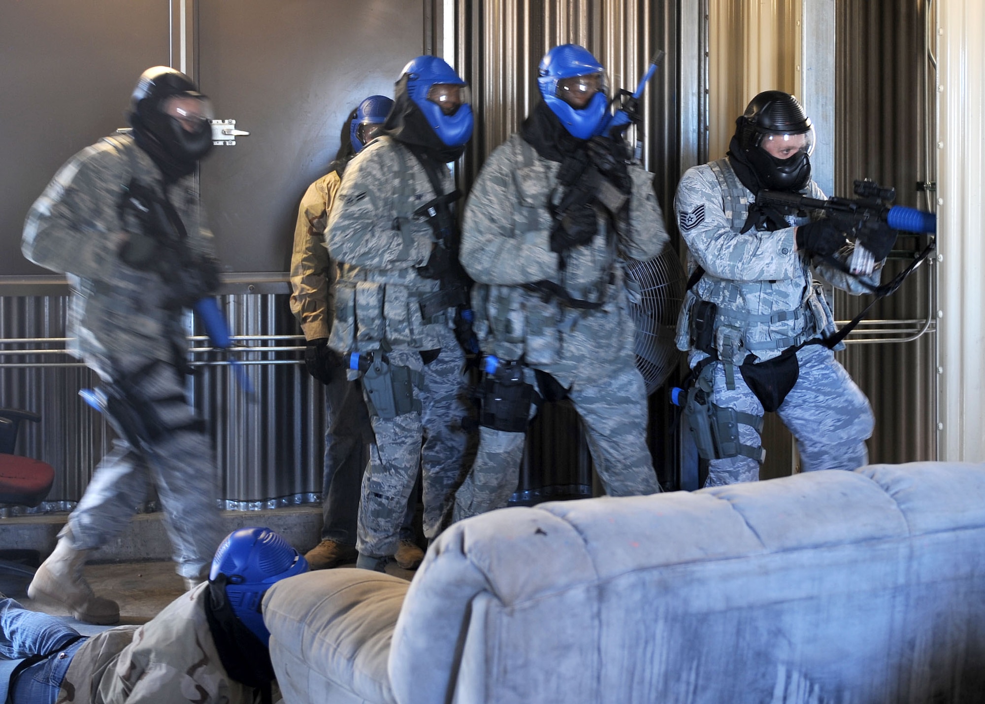 DAVIS-MONTHAN AIR FORCE BASE, Ariz. - Members of the 355th Security Forces Squadron prepare to clear a room while running a scenario during their active shooter training exercise here Nov. 24. Security forces team members train diligently for any situation they may encounter. (U.S. Air Force photo/Senior Airman Brittany Dowdle)
