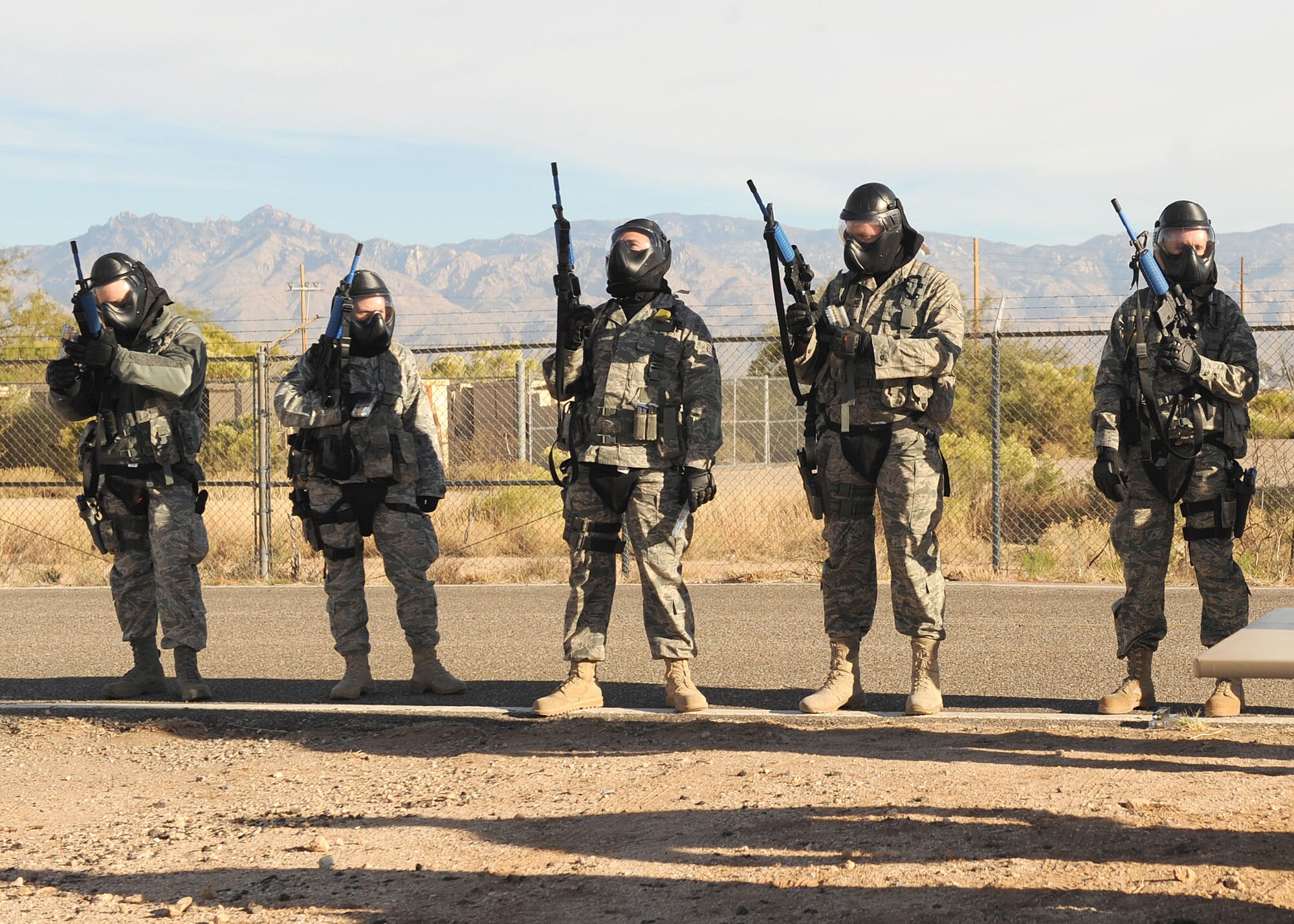 DAVIS-MONTHAN AIR FORCE BASE, Ariz. - Members of the 355th Security Forces Squadron prepare for clearing a building during an active shooter training exercise here Nov. 24. The squadron uses this training to prepare for any scenario that could potentially arise. (U.S. Air Force photo/Senior Airman Brittany Dowdle)