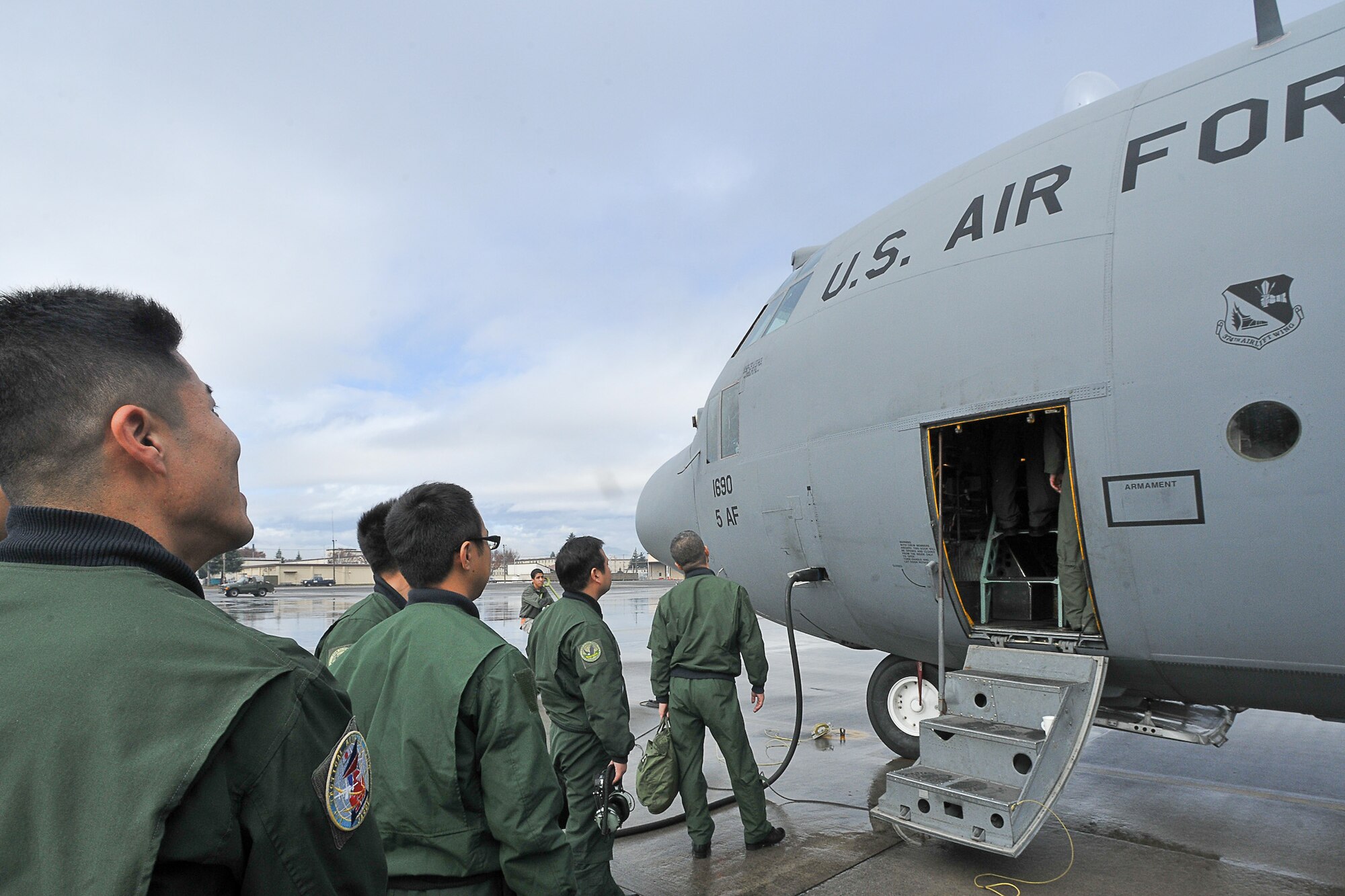 Members from the Japan Air Self-Defense Force board a C-130 Hercules Dec. 3 during Keen Sword 2011. Keen Sword is a joint-bilateral training exercise that scheduled through Dec. 10. Over the past 50 years, the United States and Japan have forged a relationship built on a shared vision of peace, prosperity, democracy and regional stability. (U.S. Air Force photo/Osakabe Yasuo)