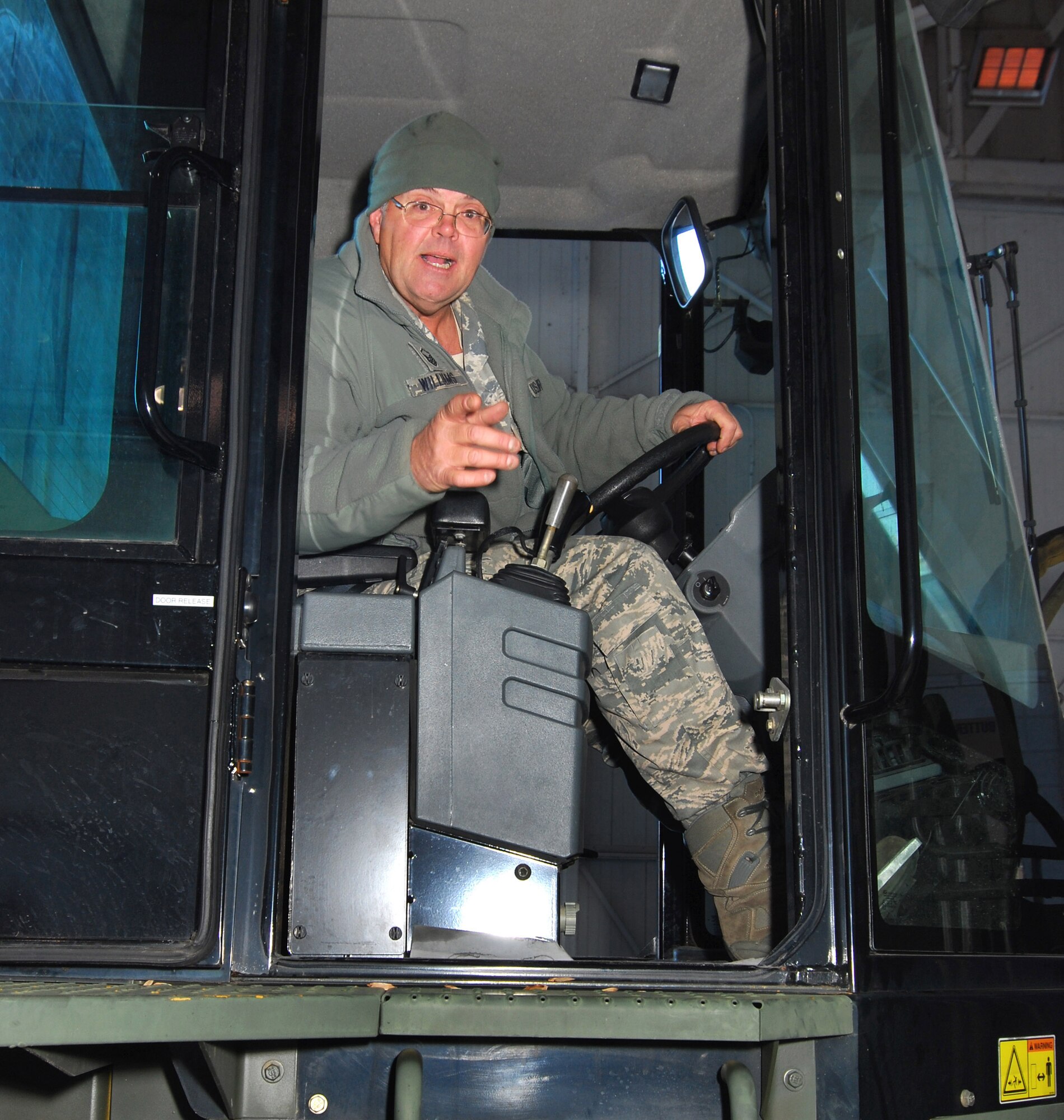 Master Sgt. David "Catfish" Williams of the 94th Aerial Delivery Flight expertly maneuvered the forklift to offload pallets of popcorn at Dobbins Air Reserve Base Ga. Dec 3.   The shipment of popcorn came from public donations solicited by Atlanta area Boy Scouts for military members working at the base.  (U.S. Air Force photo/ Brad Fallin)