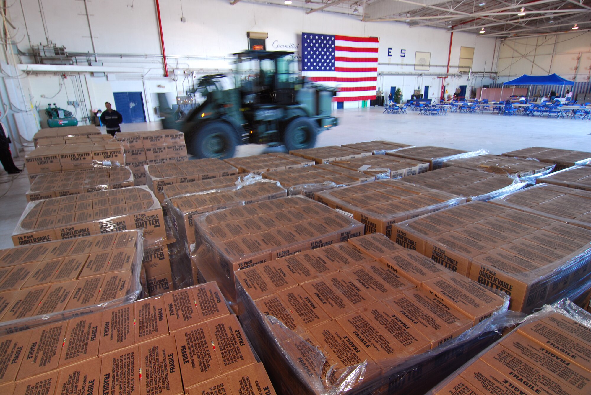 Pallets of popcorn are positioned in a hangar at Dobbins Air Reserve Base in preparation for distribution to military members working at the base, Dec 3.  The Atlanta area Boy Scouts of America solicited donations from the public in order to provide this treat.  (U.S. Air Force photo/ Brad Fallin)