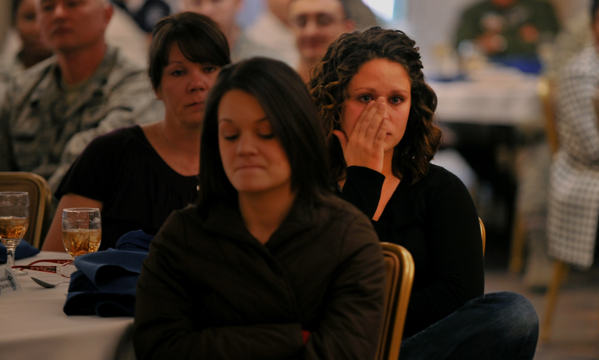 MOODY AIR FORCE BASE, Ga.-- Amanda Parsons, daughter of Chief Master Sgt. Richard Parsons, 23rd Wing command chief, wipes a tear from her eye after a few heartfelt words during his going away luncheon Dec. 3. Chief Parsons’ wife Lynn and second daughter Amy attended the luncheon as well. (U.S. Air Force photo/Airman 1st Class Joshua Green)(RELEASED)
