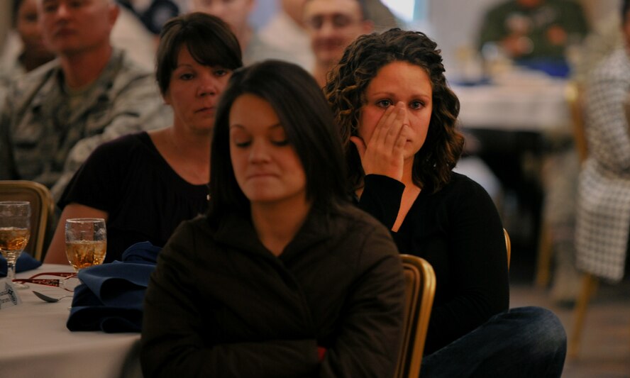 MOODY AIR FORCE BASE, Ga.-- Amanda Parsons, daughter of Chief Master Sgt. Richard Parsons, 23rd Wing command chief, wipes a tear from her eye after a few heartfelt words during his going away luncheon Dec. 3. Chief Parsons’ wife Lynn and second daughter Amy attended the luncheon as well. (U.S. Air Force photo/Airman 1st Class Joshua Green)(RELEASED)
