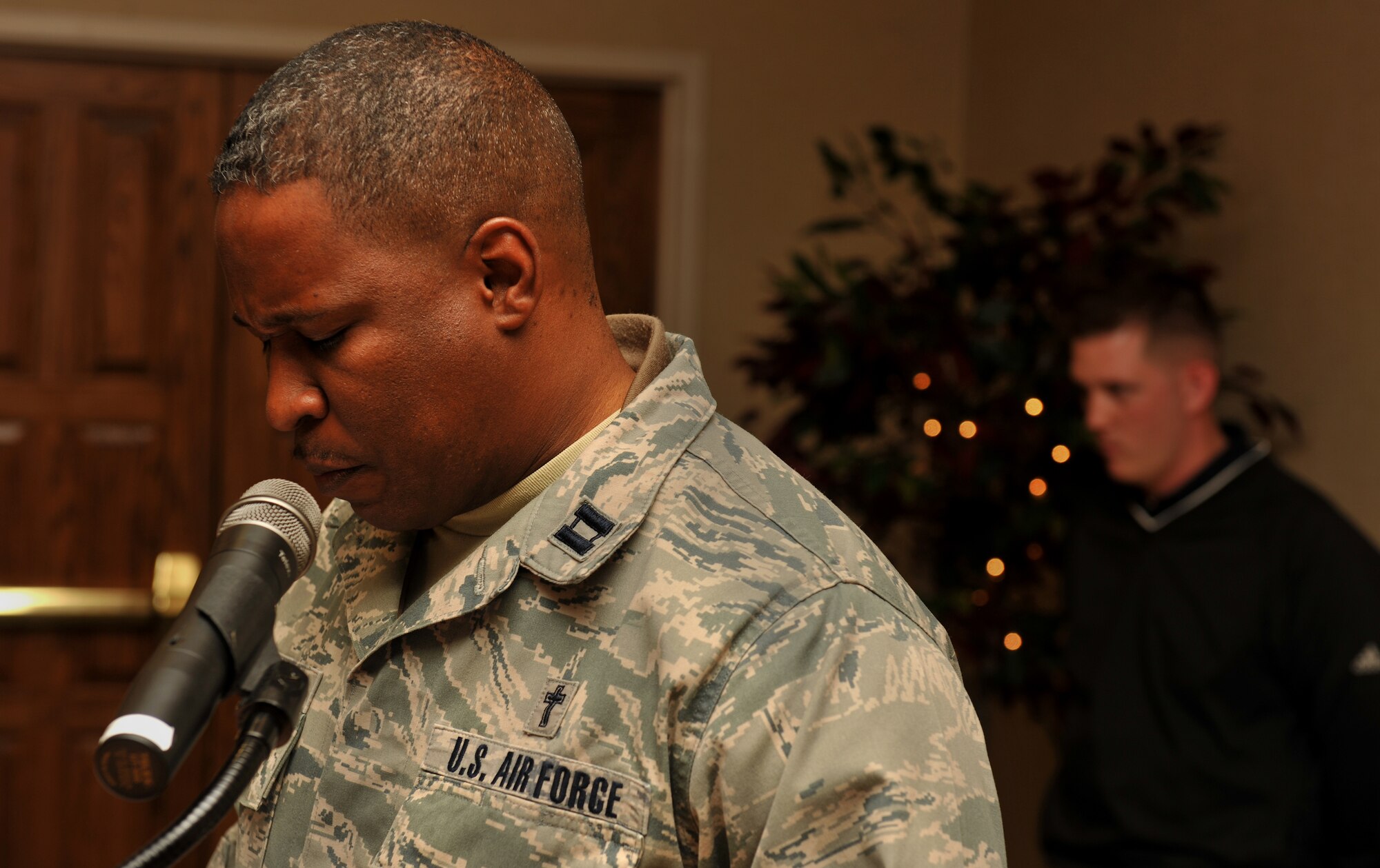 MOODY AIR FORCE BASE, Ga.-- Chaplain (Capt.) Jonathan Runnels, 23rd Wing, gives the opening prayer during the going-away luncheon of Chief Master Sgt. Richard Parsons, 23rd Wing command chief, Dec. 3. Chief Parsons will be leaving the 23rd Wing to fill a command chief position overseas. (U.S. Air Force photo/Airman 1st Class Joshua Green)(RELEASED)
