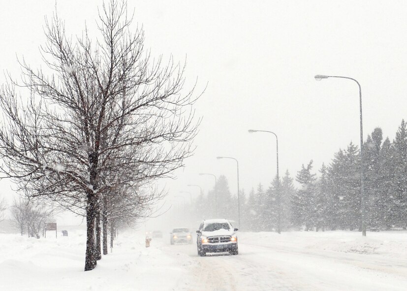 MINOT AIR FORCE BASE, N.D. -- Cars and sport utility vehicles can be seen traveling east on Missile Avenue here Dec. 3. Winter driving in North Dakota can be a dangerous time for those who have never been in this kind of environment. Extra caution should be exercised when on the roads and allow for extra travel time to make sure everyone arrives safely. (U.S. Air Force photo/Staff Sgt. Keith Ballard)