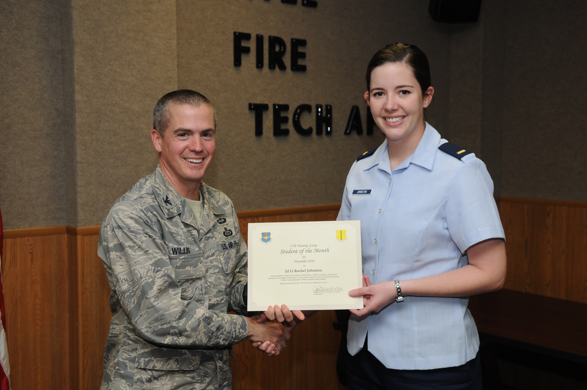 GOODFELLOW AIR FORCE BASE, Texas -- 2nd Lt. Rachel Johnston, 315th Training Squadron, accepts her November Student of the Month award from Col. J.D. Willis, 17th Training Group Commander.  The 315th Training Squadron is the only squadron here with both officer and enlisted students who are recognized monthly. (U.S. Air Force photo/Airman 1st Class Clayton Lenhardt)