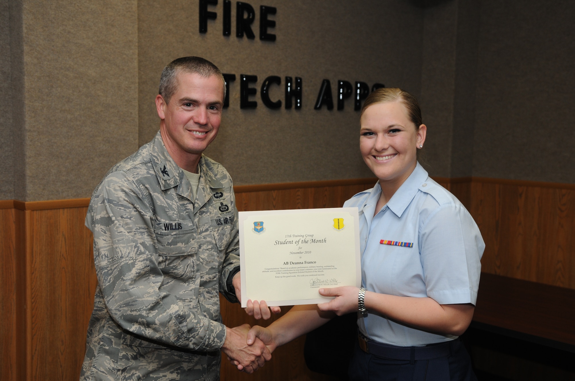 GOODFELLOW AIR FORCE BASE, Texas -- Airman Basic Deanna Franco, 315th Training Squadron, accepts her November Student of the Month award from Col. J.D. Willis, 17th Training Group Commander.  The 315th Training Squadron is the only squadron here with both officer and enlisted students who are recognized monthly. (U.S. Air Force photo/Airman 1st Class Clayton Lenhardt)