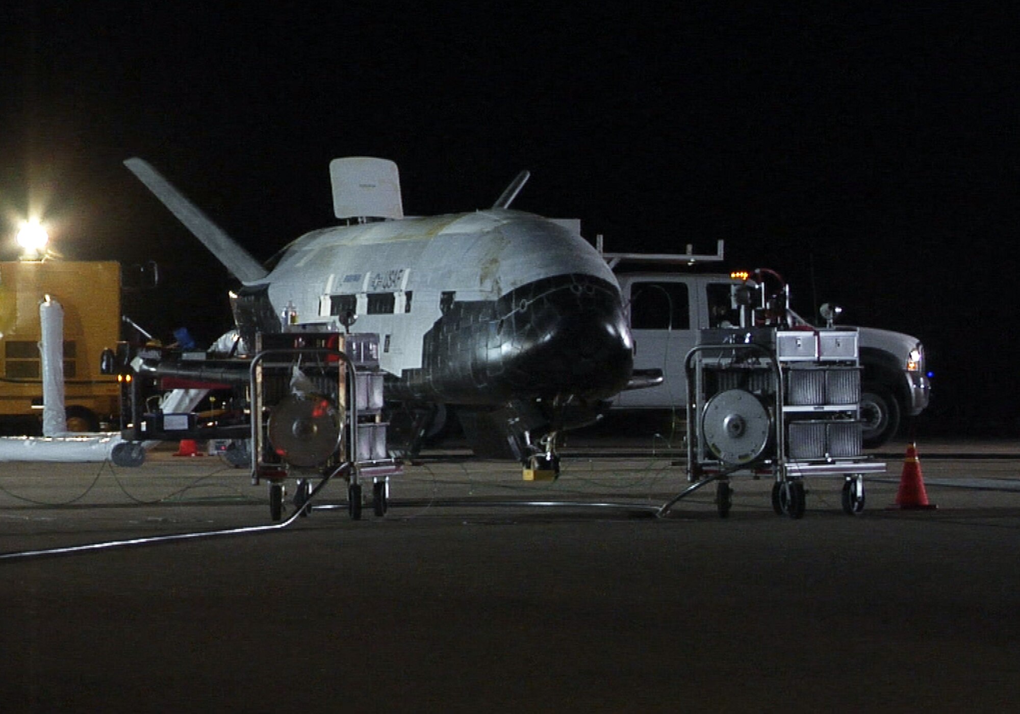 The X-37B, named Orbital Test Vehicle 1 (OTV-1), sits on the Vandenberg Air Force base runway during post-landing operations Dec. 3. The Air Force is preparing to launch the next X-37B, OTV-2, in Spring 2011 aboard an Atlas V booster. (U.S. Air Force photo/ Michael Stonecypher)
