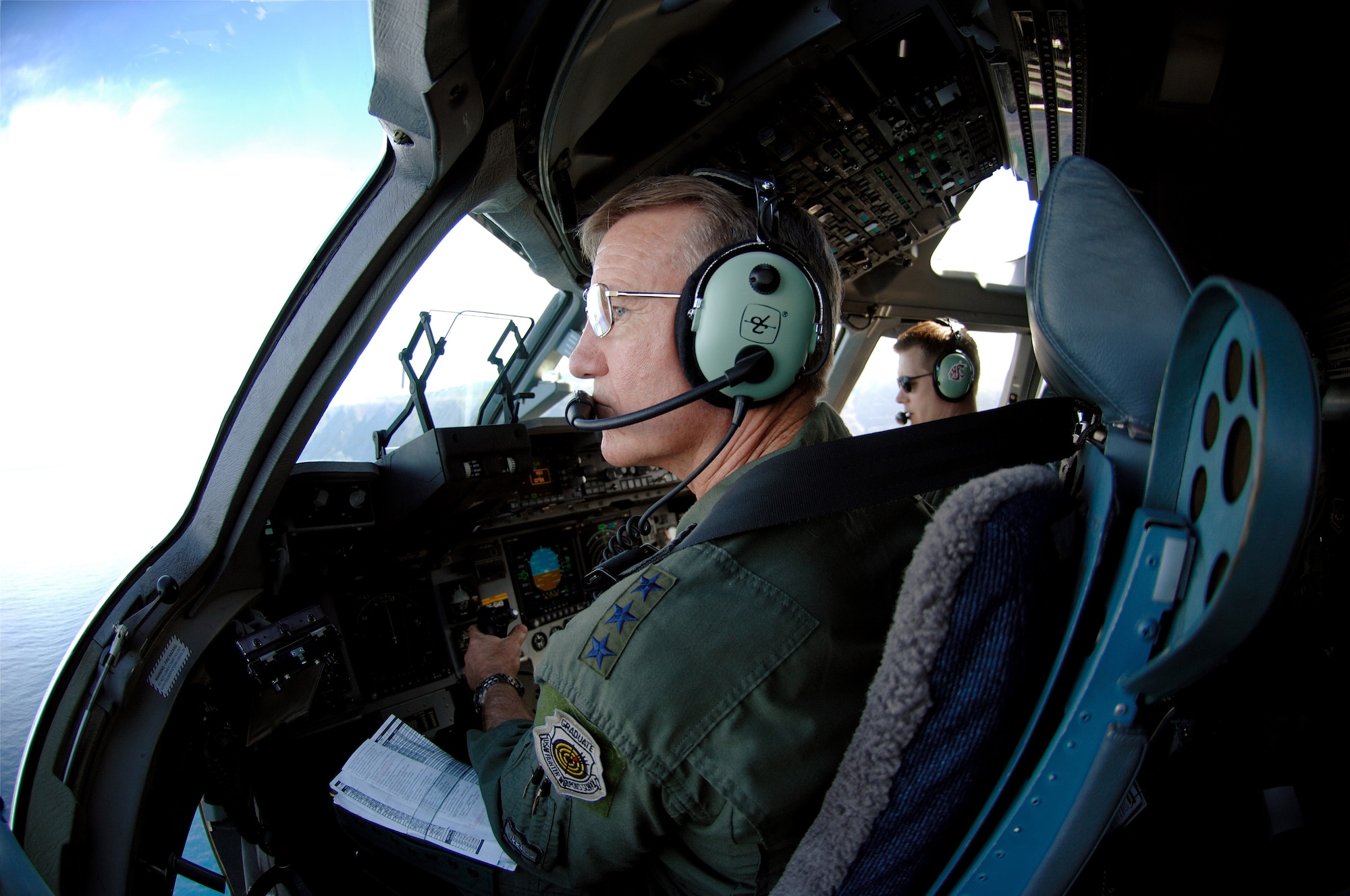 Lt. Gen. Herbert "Hawk" Carlisle, 13th Air Force commander, takes in the view of the Hawaiian Islands Nov. 30 during during his final flight as 13th AF commander. General Carlisle's final flight was supported by the 15th Wing's 535th Airlift Squadron here. General Carlisle has been confirmed for assignment as Deputy Chief of Staff, Operations, Plans and Requirements, Headquarters U.S. Air Force, Washington, D.C. (U.S. Air Force photo by Mark Bates)