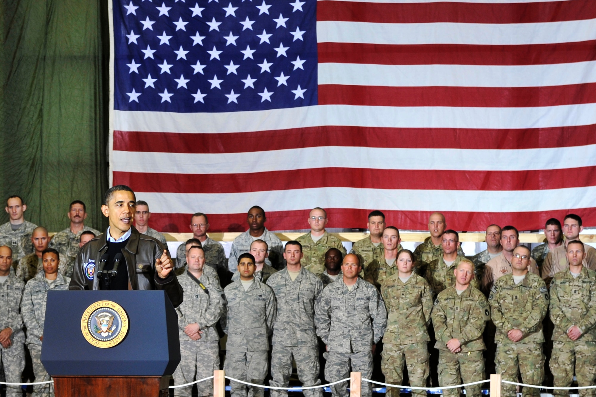 President Barack Obama spoke with Airmen, Soldiers, Sailors and Marines during a visit to Bagram Airfield, Afghanistan, Dec. 3, 2010. President Obama addressed current issues including the troop surge, pay freeze and extended his appreciation to the men and women of the armed forces serving around the world. (U.S. Air Force photo/Staff Sgt. Christopher Boitz) 