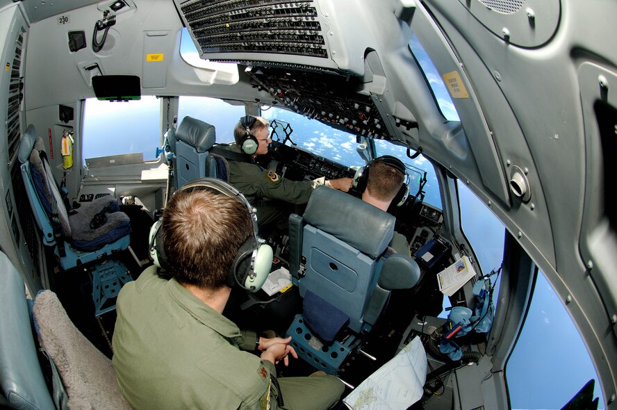 Lt. Gen. Herbert "Hawk" Carlisle, 13th Air Force commander, and two other aircrew members fly over the Pacific Ocean Nov. 30 during Gen. Carlisle's final flight as 13th AF commander.. General Carlisle's final flight was supported by the 15th Wing's 535th Airlift Squadron here. General Carlisle has been confirmed for assignment as Deputy Chief of Staff, Operations, Plans and Requirements, Headquarters U.S. Air Force, Washington, D.C. (U.S. Air Force photo by Mark Bates)
