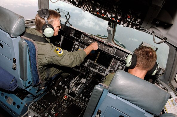 Lt. Gen. Herbert "Hawk" Carlisle, 13th Air Force commander, and two other aircrew members fly over the Pacific Ocean Nov. 30 during Gen. Carlisle's final flight as 13th AF commander.. General Carlisle's final flight was supported by the 15th Wing's 535th Airlift Squadron here. General Carlisle has been confirmed for assignment as Deputy Chief of Staff, Operations, Plans and Requirements, Headquarters U.S. Air Force, Washington, D.C. (U.S. Air Force photo by Mark Bates)