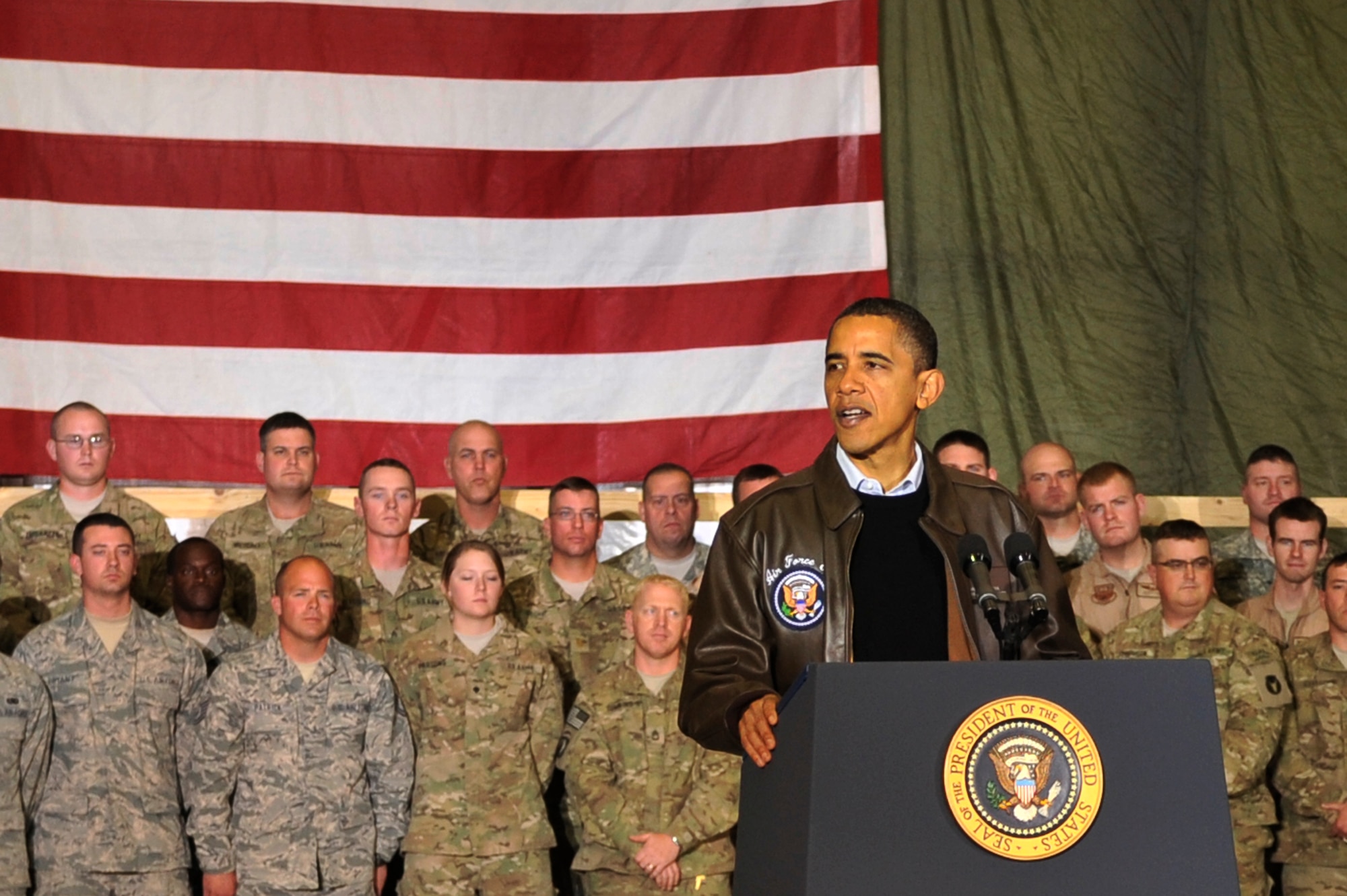 President Barack Obama spoke with Airmen, Soldiers, Sailors and Marines during a visit to Bagram Airfield, Afghanistan, Dec. 3, 2010. President Obama addressed current issues including the troop surge, pay freeze and extended his appreciation to the men and women of the armed forces serving around the world. (U.S. Air Force photo/Staff Sgt. Christopher Boitz) 