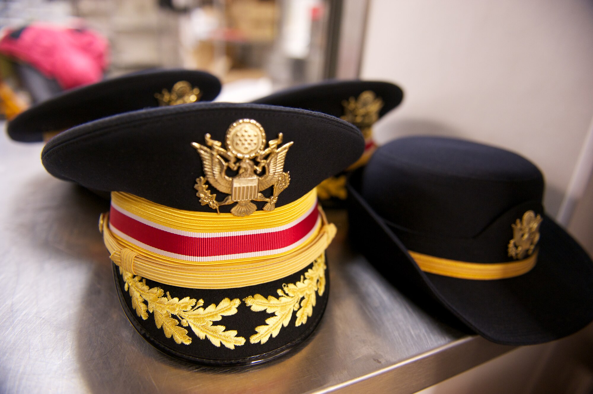 JOINT BASE ELMENDORF-RICHARDSON, Alaska -- Service hats rest in exchange for cook hats, Thanksgiving, at the Gold Rush Inn Dining Facility. Joint Base Elmendorf-Richardson leadership served meals in shifts. (Photo by David Bedard/JBER PAO)