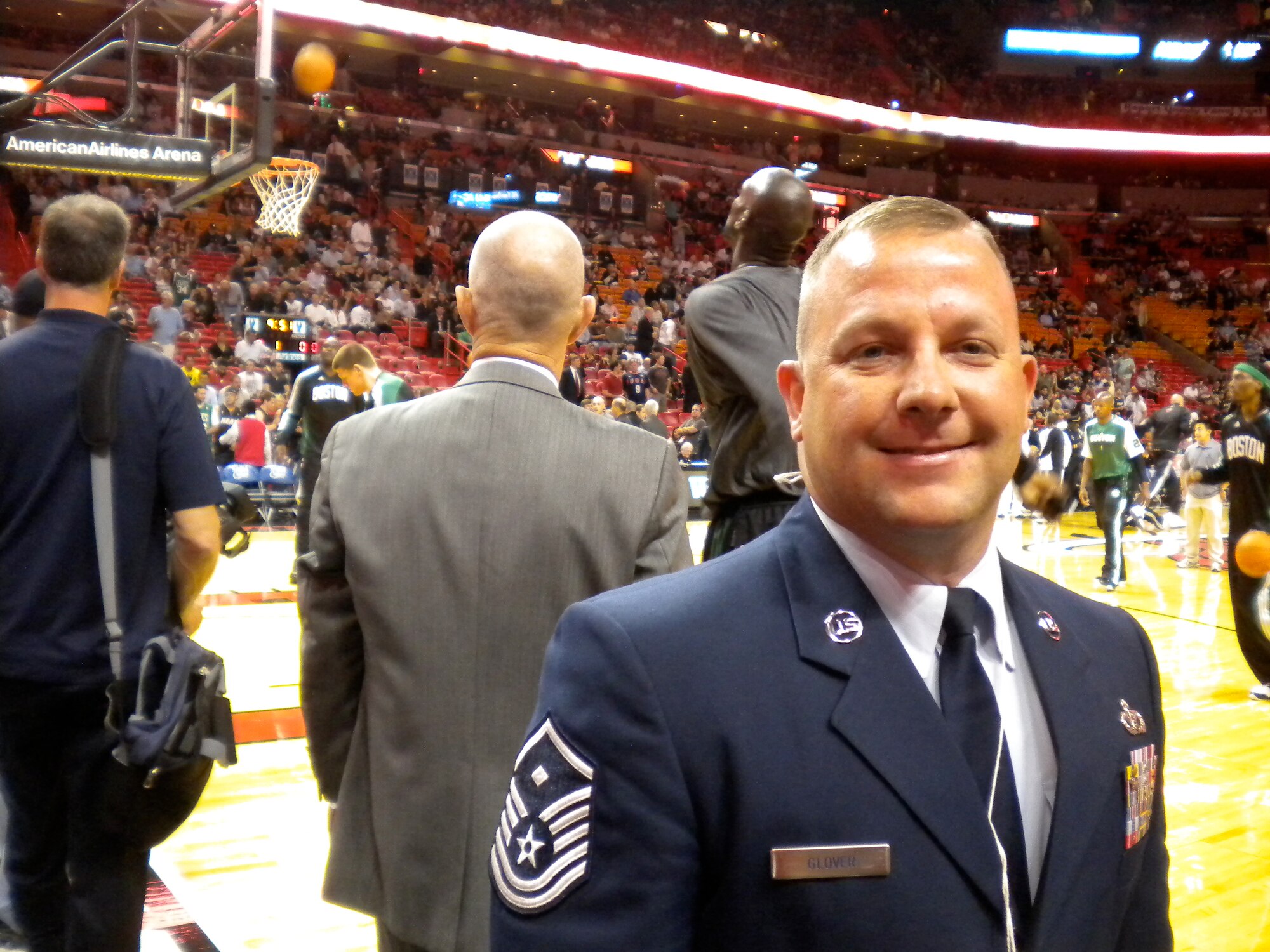 Master Sgt. Jonathan Glover, 23rd Air Force first sergeant, stands on the basketball court at the American Airlines Arena in Miami, Nov. 11, 2010. Sergeant Glover sang the national anthem during the Veterans Day game held between the Miami HEAT and Boston Celtics. (Courtesy photo)