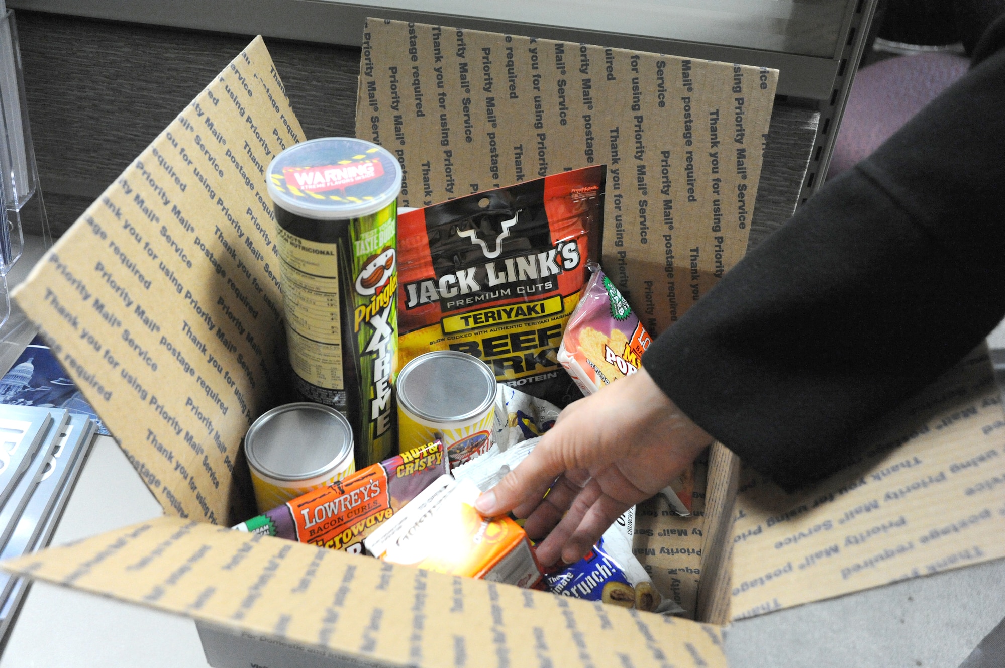 A deployment can be a lonely time in an Airman's life, but care packages, such as this one, create a long-distance connection that can make a big difference. (U.S. Air Force photo/Rich McFadden)