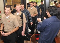 Students from Lackland's Naval Technical Training Center arrive for Thanksgiving dinner at Z'Tejas Southwestern Grill Nov. 25. The restaurant served 150 Sailors in support of Operation Homecooking. (U.S. Air Force photo/Alan Boedeker)   